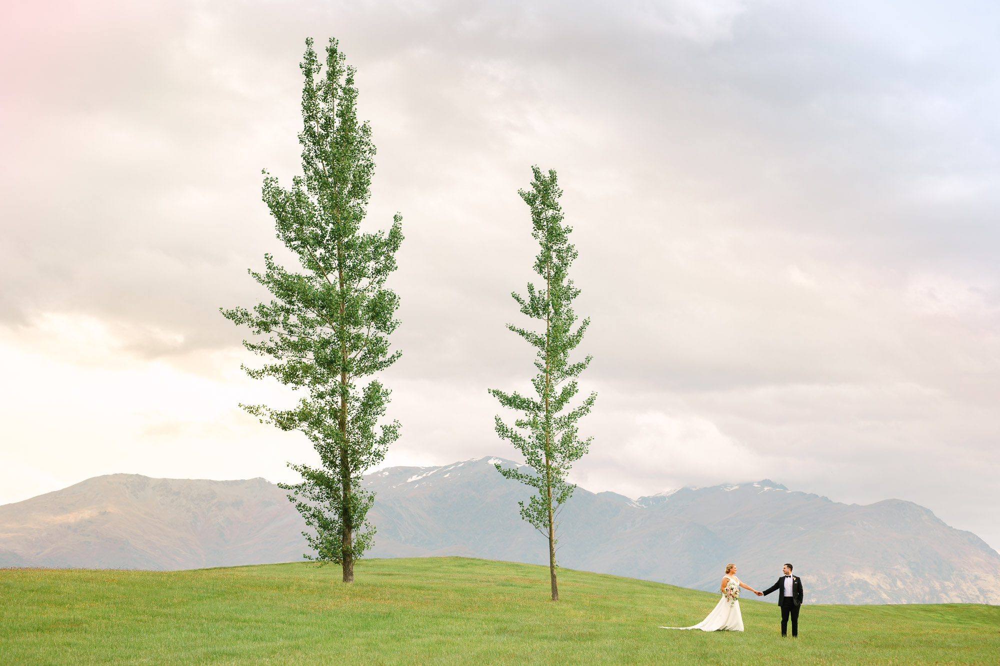 Millbrook Resort New Zealand wedding couple with two trees by Mary Costa Photography
