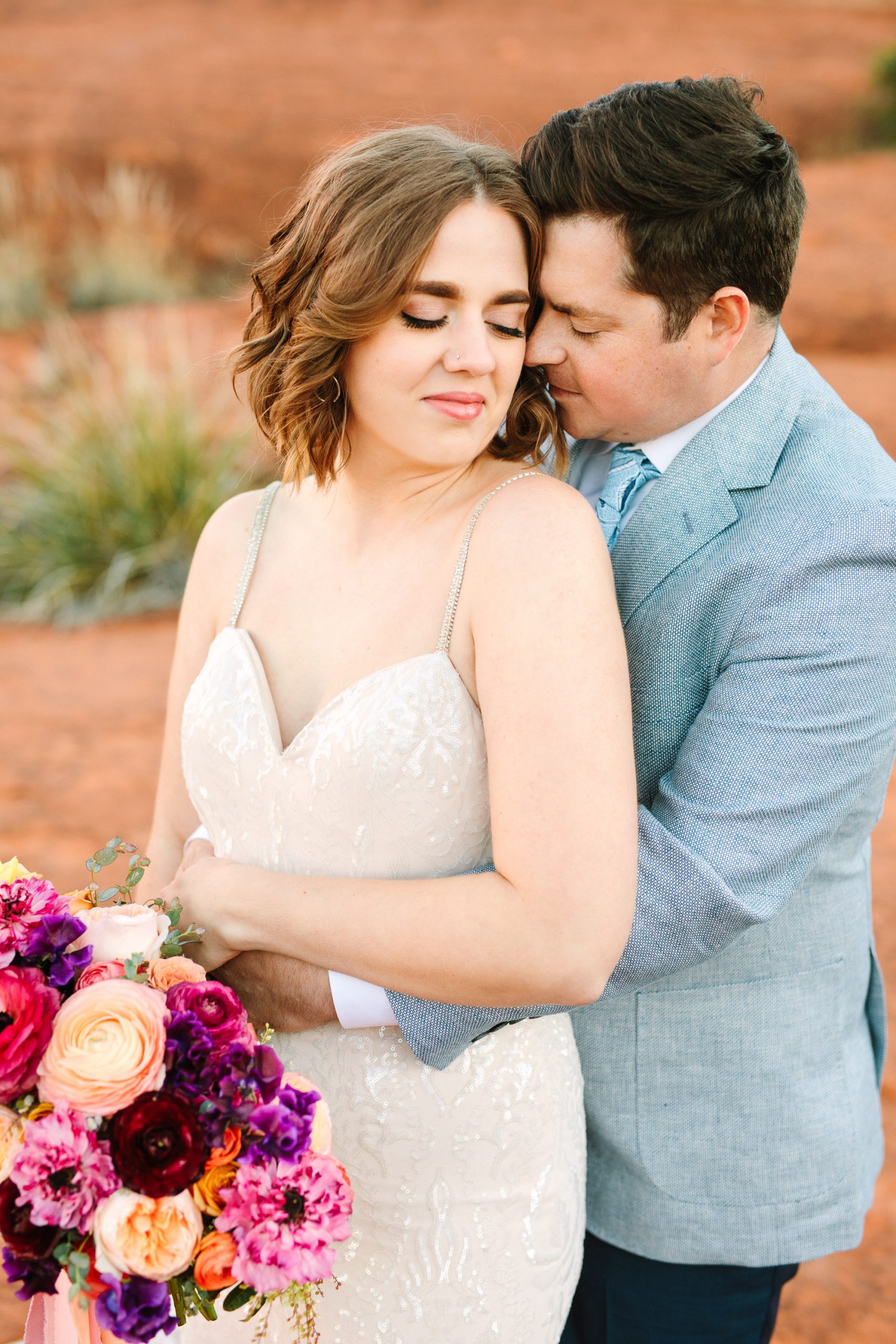Couple snuggling in Sedona by Mary Costa Photography