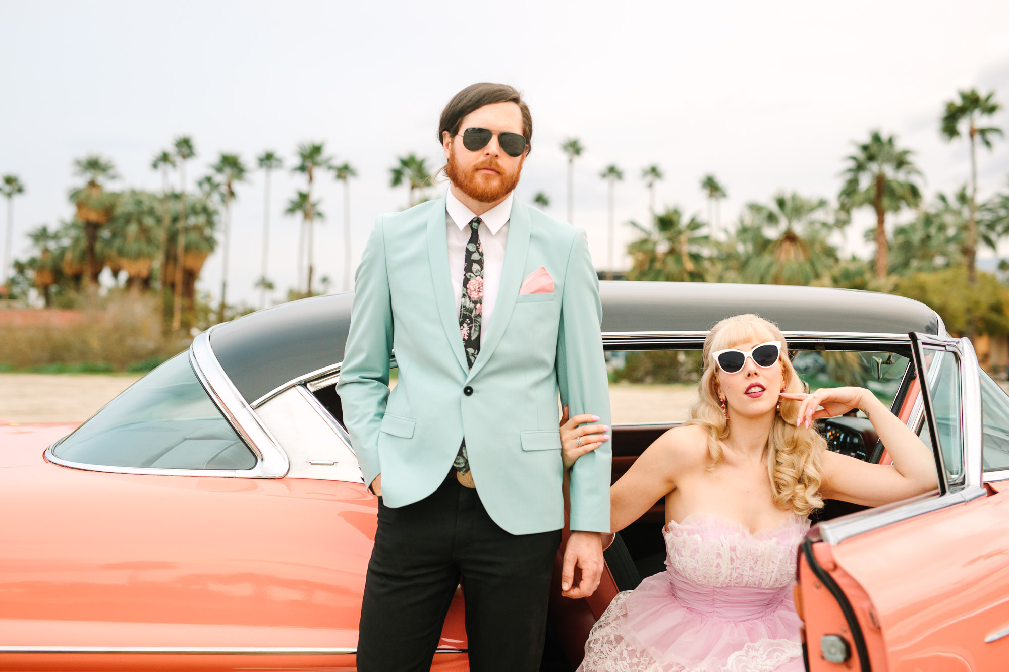 Palm Springs couple with vintage pink car by Mary Costa Photography