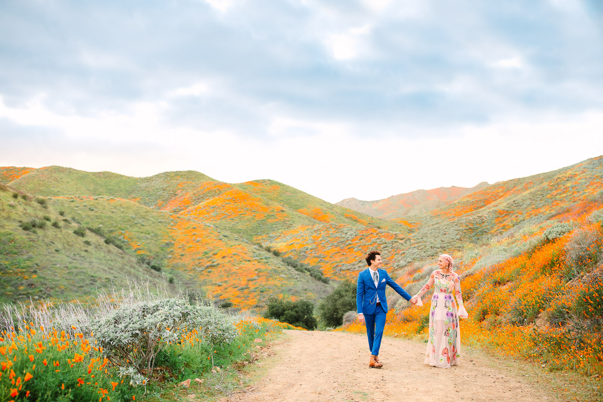 Couple on Walker Canyon poppy trail by Mary Costa Photography