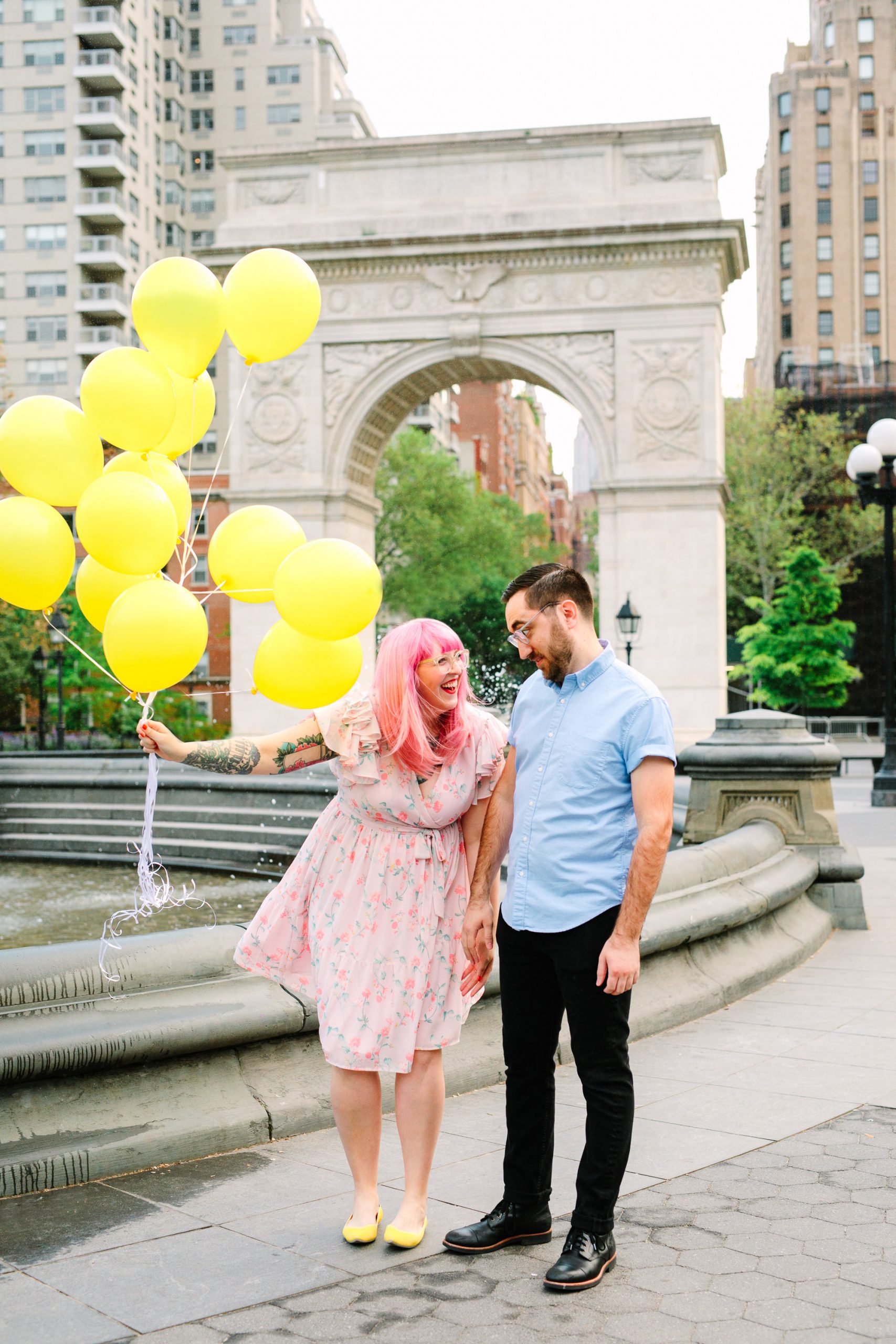 Playful couple in NYC's Washington Square Park by Mary Costa Photography