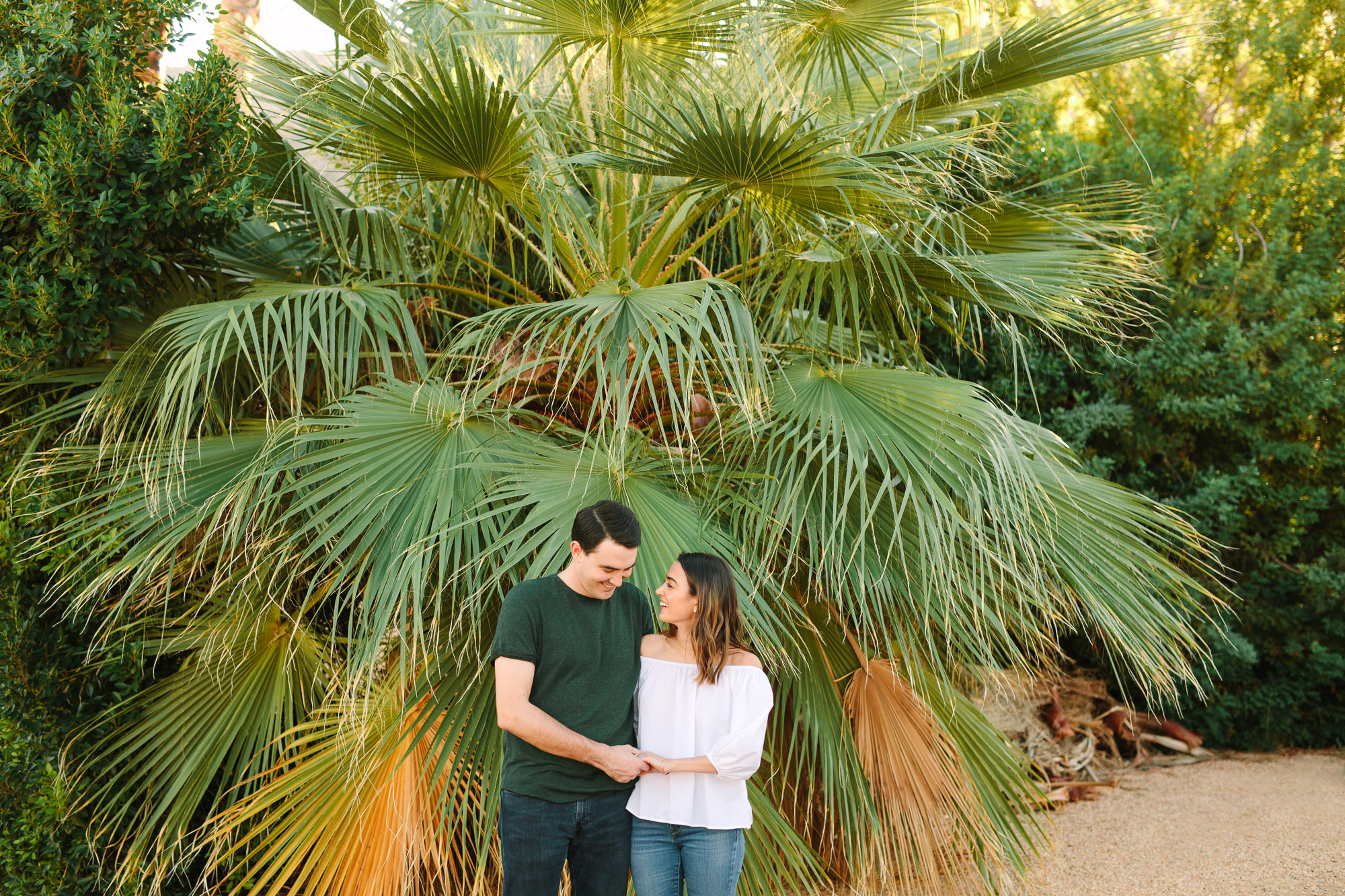 Couple with giant palm trees www.marycostaweddings.com