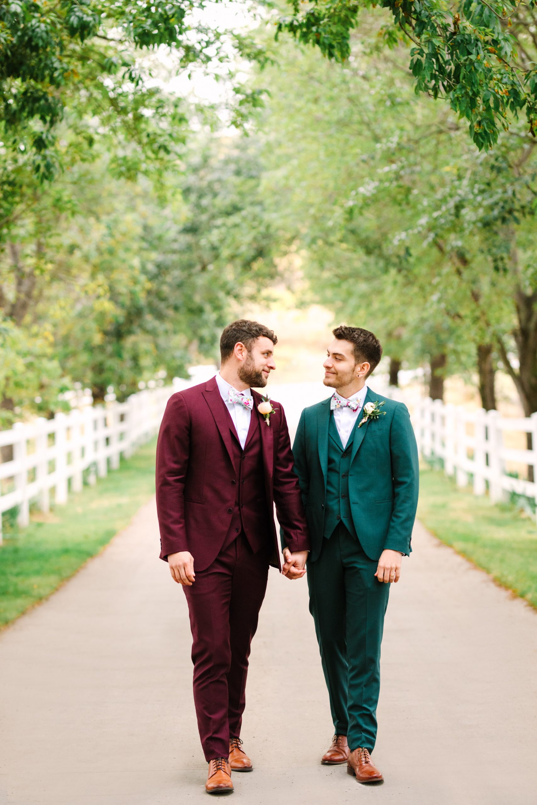 Two grooms walking by Mary Costa Photography