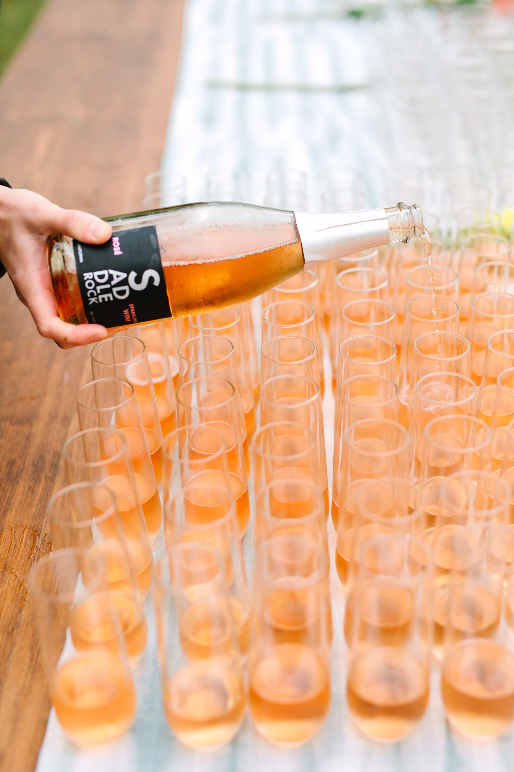 Bubbly pour at wedding by Mary Costa Photography