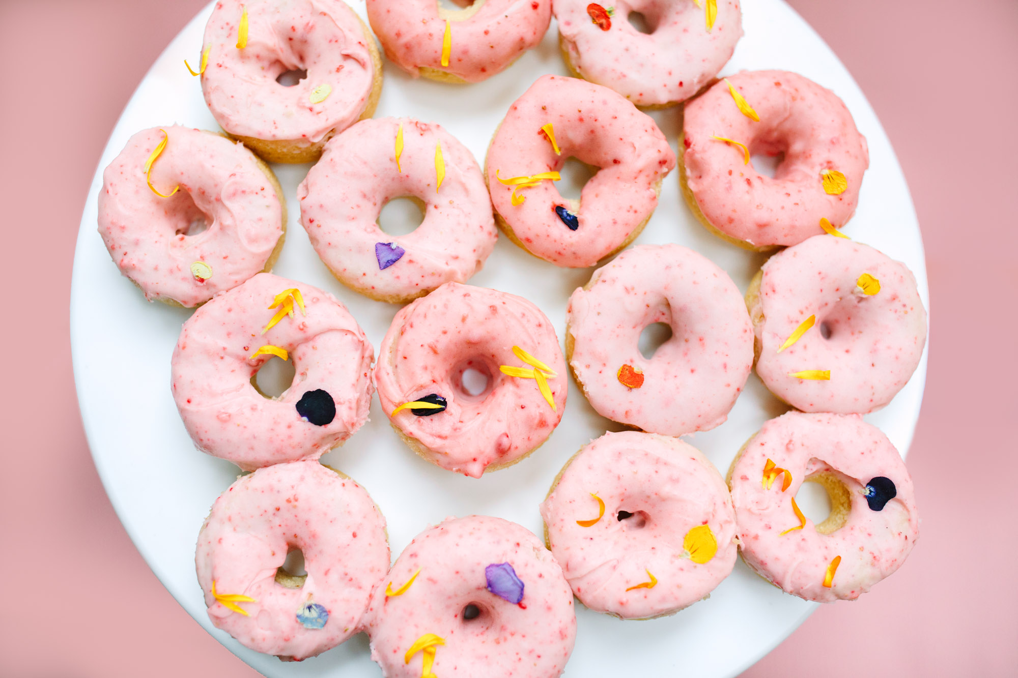Donuts with edible flowers by Mary Costa Photography