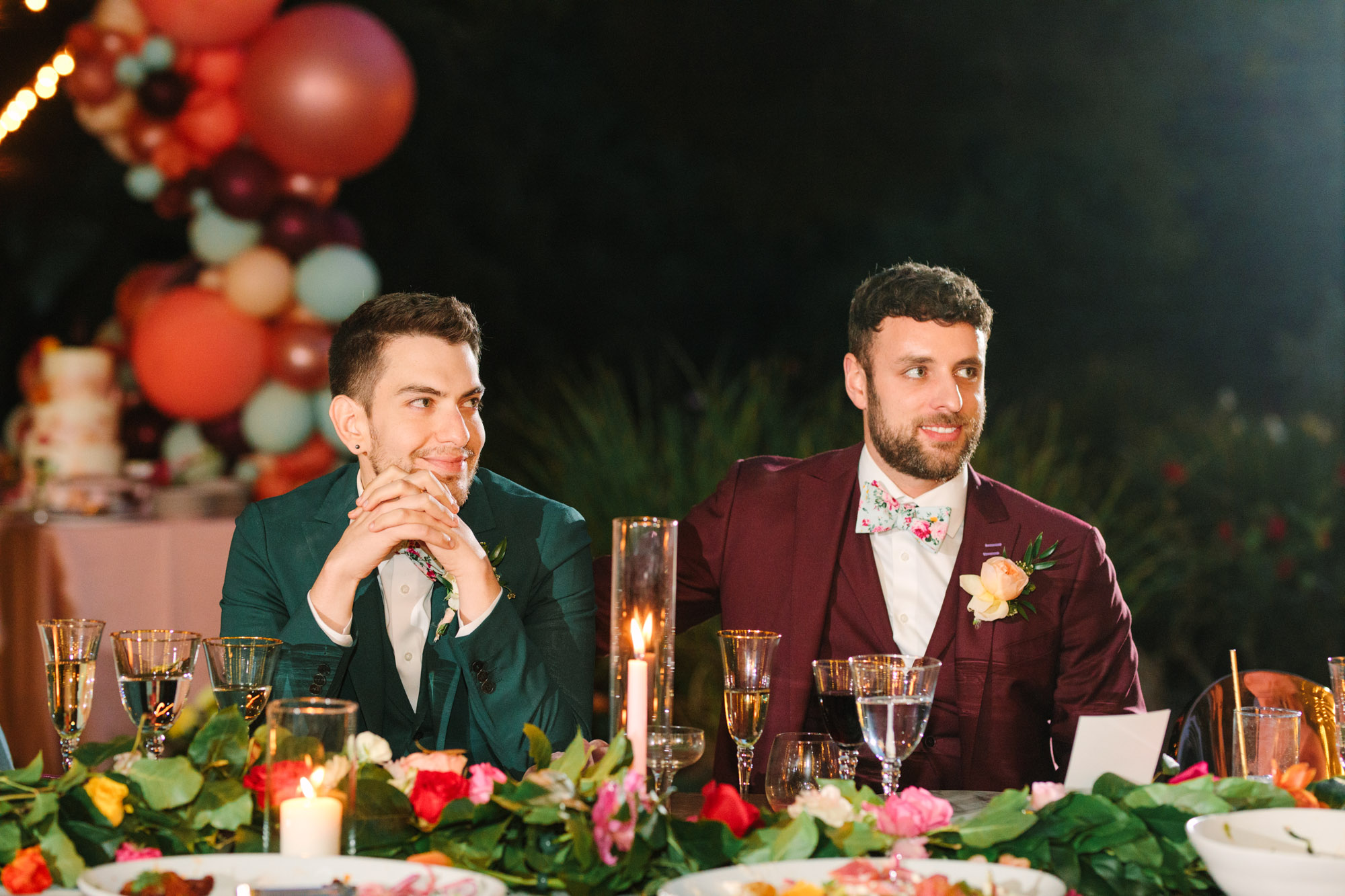 Grooms listening to wedding speech by Mary Costa Photography