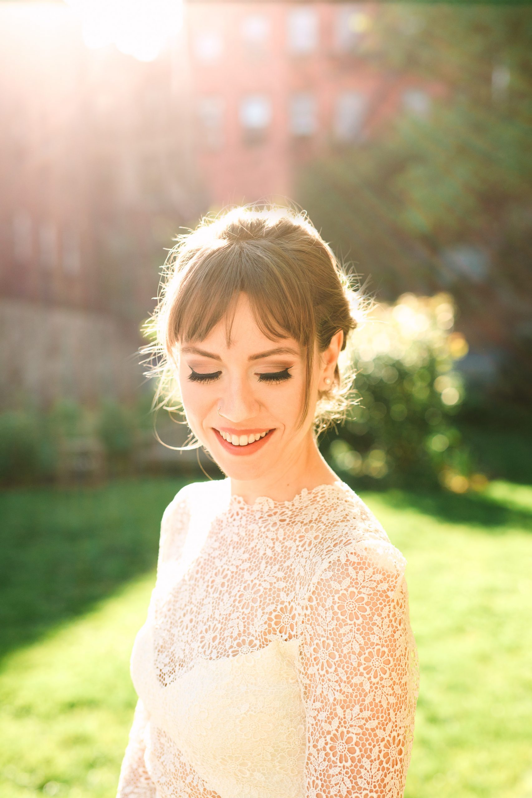 Backlit bride in NYC wearing Anais Anette gown - www.marycostaweddings.com