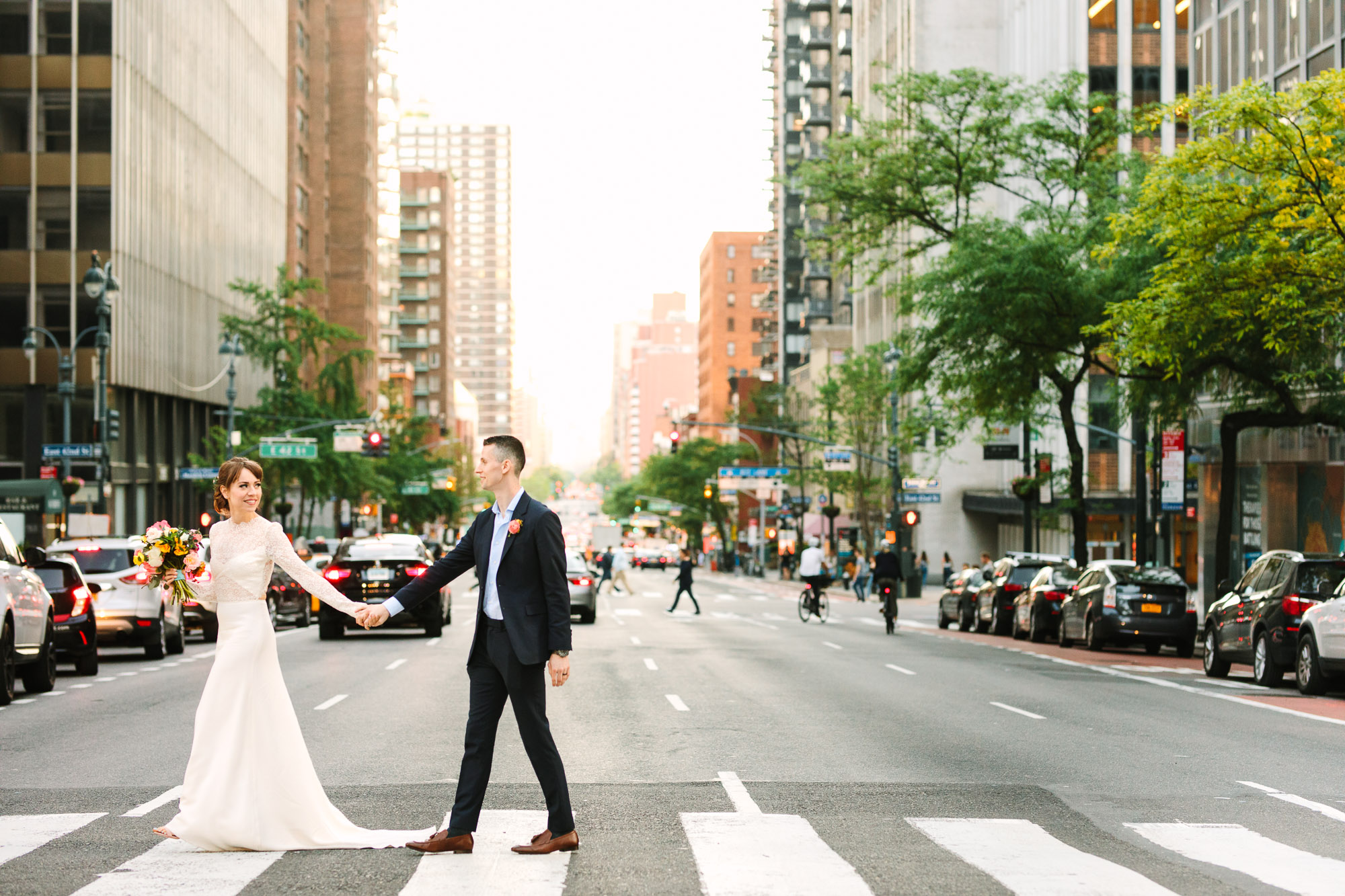Bride and groom in NYC crosswalk - www.marycostaweddings.com