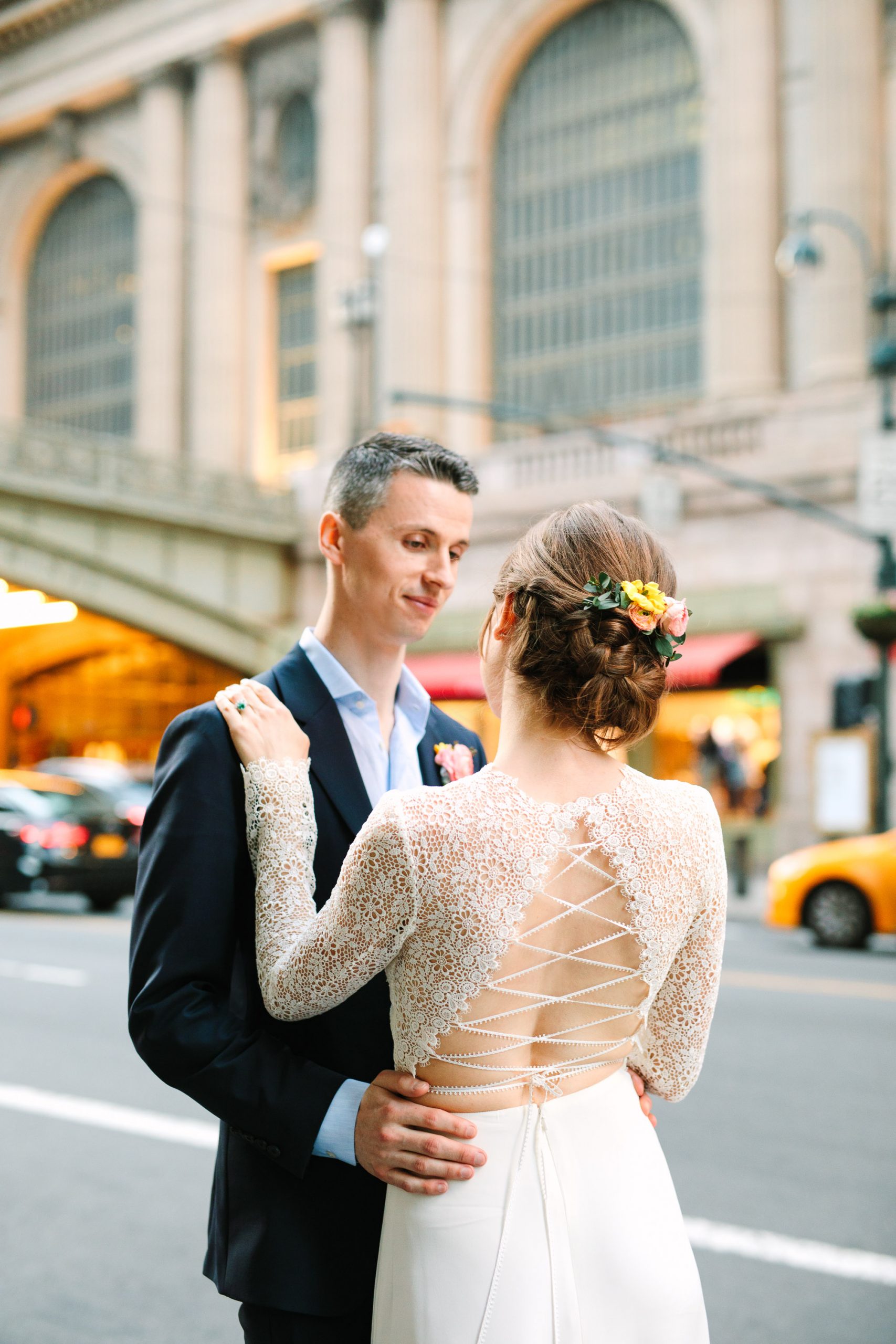Bride and groom in front of Grand Central Station - www.marycostaweddings.com