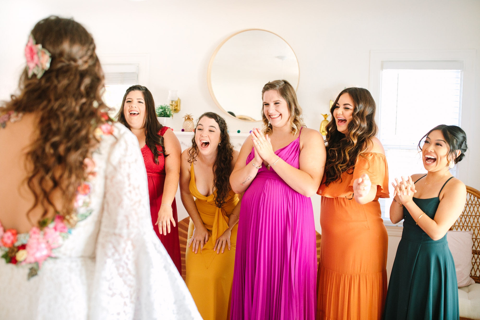 Bride's first look with colorful bridesmaids - www.marycostaweddings.com
