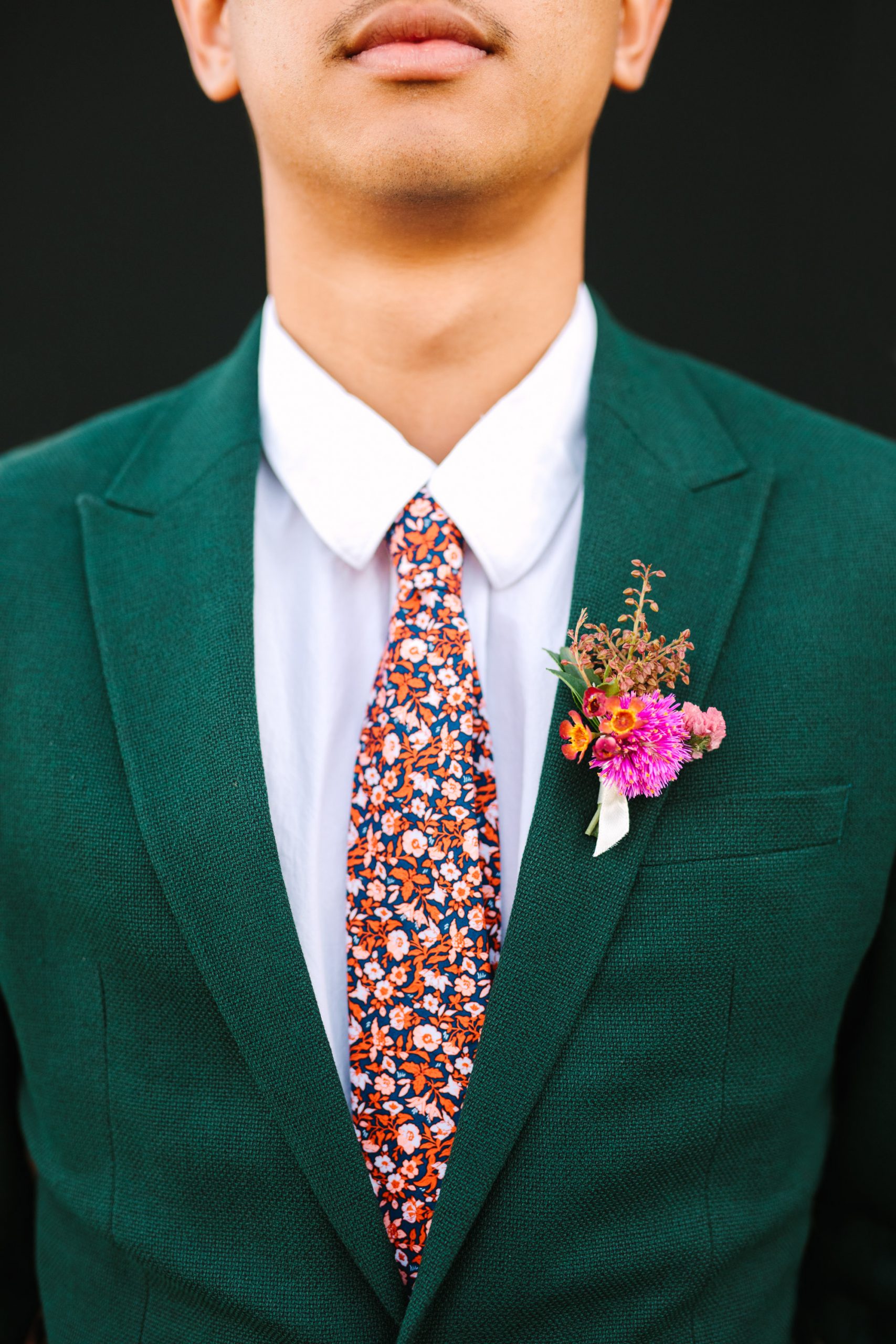 Groomsman emerald suit with floral tie - www.marycostaweddings.com