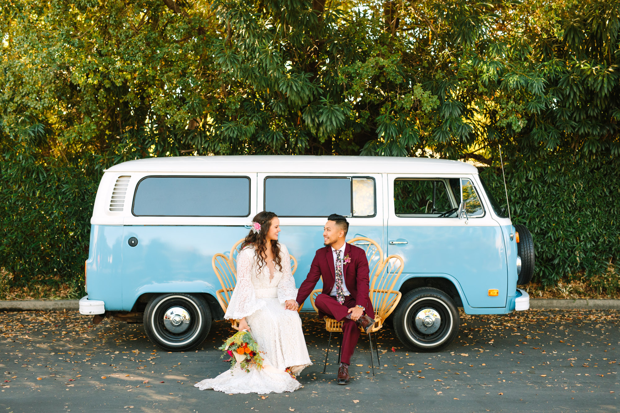 Bride and groom sitting in chairs in front of VW Van at BLOC Venue Roseville - www.marycostaweddings.com