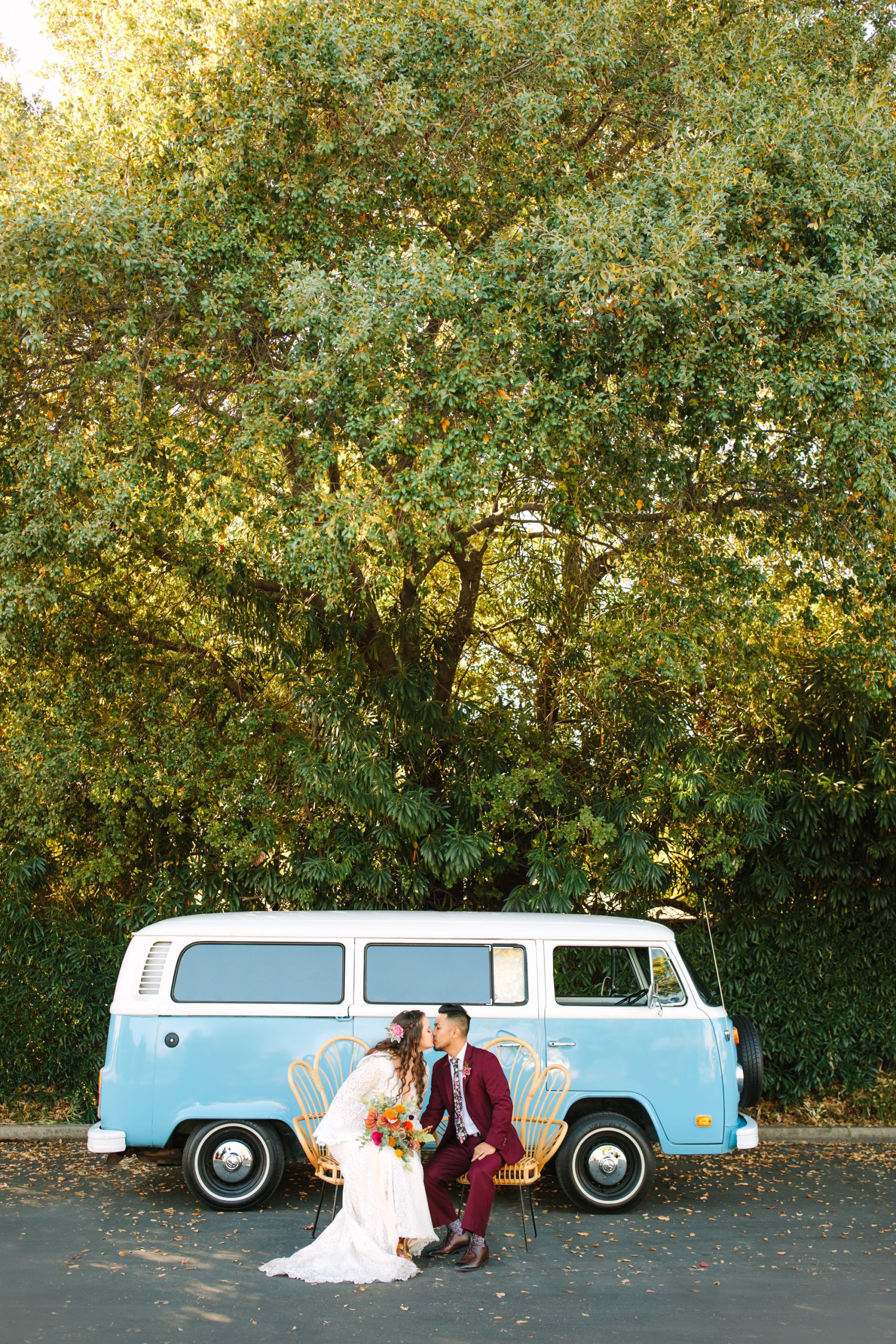 Bride and groom kissing in front of VW Van at BLOC Venue Roseville - www.marycostaweddings.com