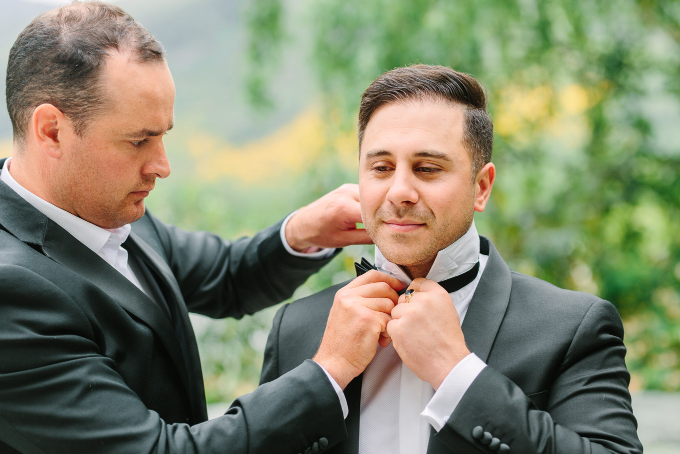 Groom getting dressed at Millbrook Resort Queenstown New Zealand wedding by Mary Costa Photography | www.marycostaweddings.com
