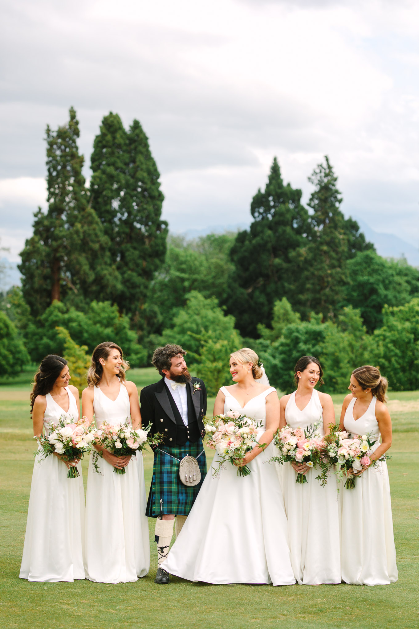 Bridal party with best man in traditional Scottish kilt. Millbrook Resort Queenstown New Zealand wedding by Mary Costa Photography | www.marycostaweddings.com