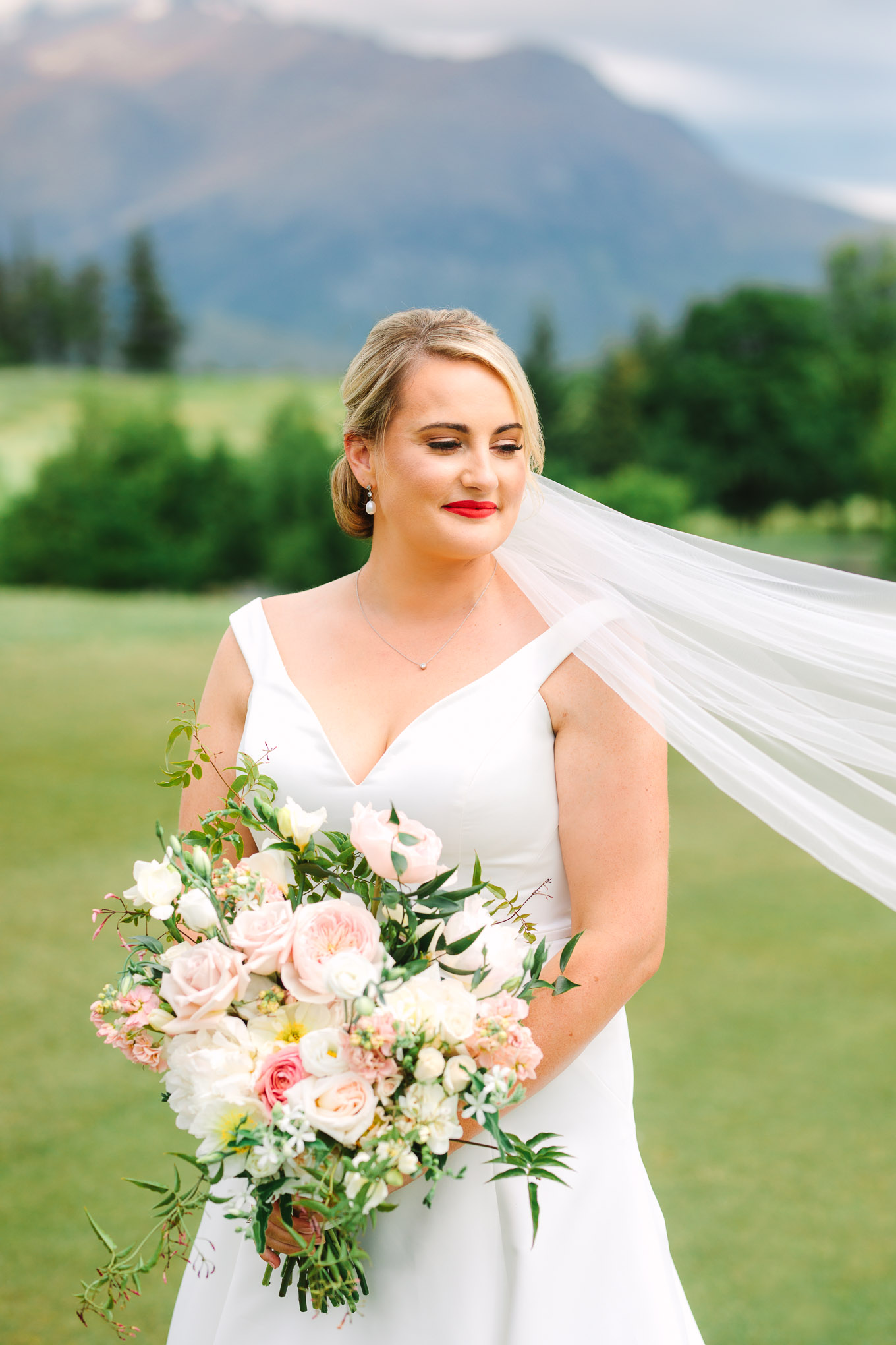 Classic bridal portrait with off-the-shoulder gown and romantic pink and white bridal bouquet. Millbrook Resort Queenstown New Zealand wedding by Mary Costa Photography | www.marycostaweddings.com