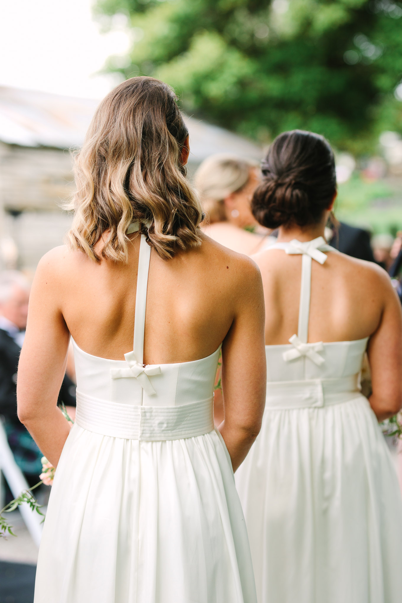 Detail of bridesmaids' dress during wedding ceremony. Millbrook Resort Queenstown New Zealand wedding by Mary Costa Photography | www.marycostaweddings.com