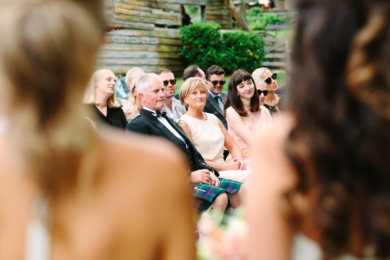 Candid of bride's family during wedding ceremony. Millbrook Resort Queenstown New Zealand wedding by Mary Costa Photography | www.marycostaweddings.com