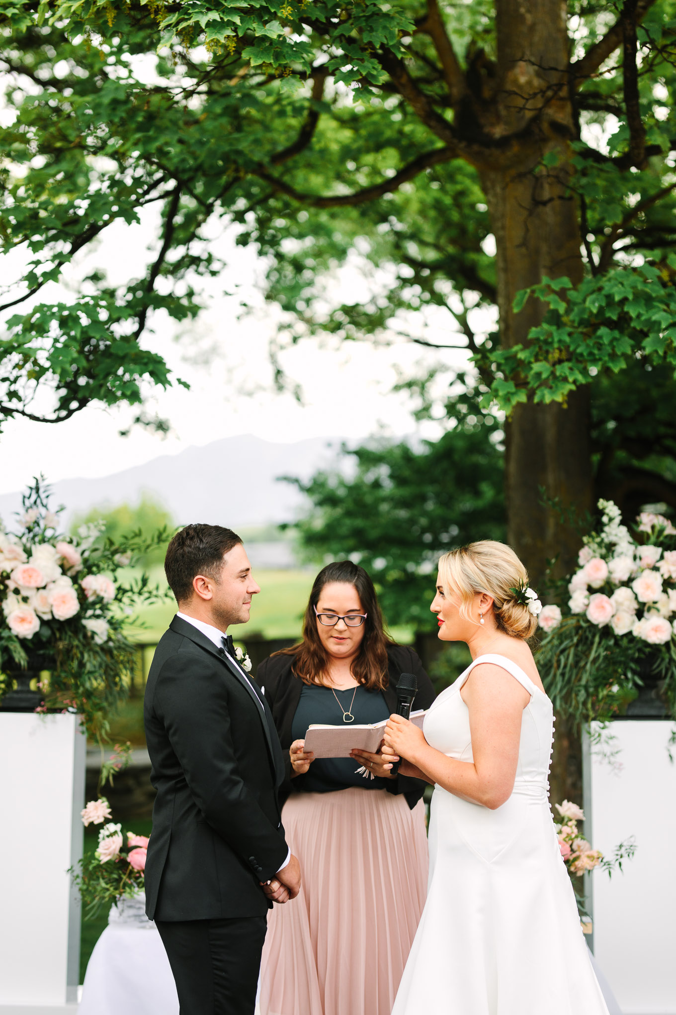 Bride and groom exchanging vows. Millbrook Resort Queenstown New Zealand wedding by Mary Costa Photography | www.marycostaweddings.com