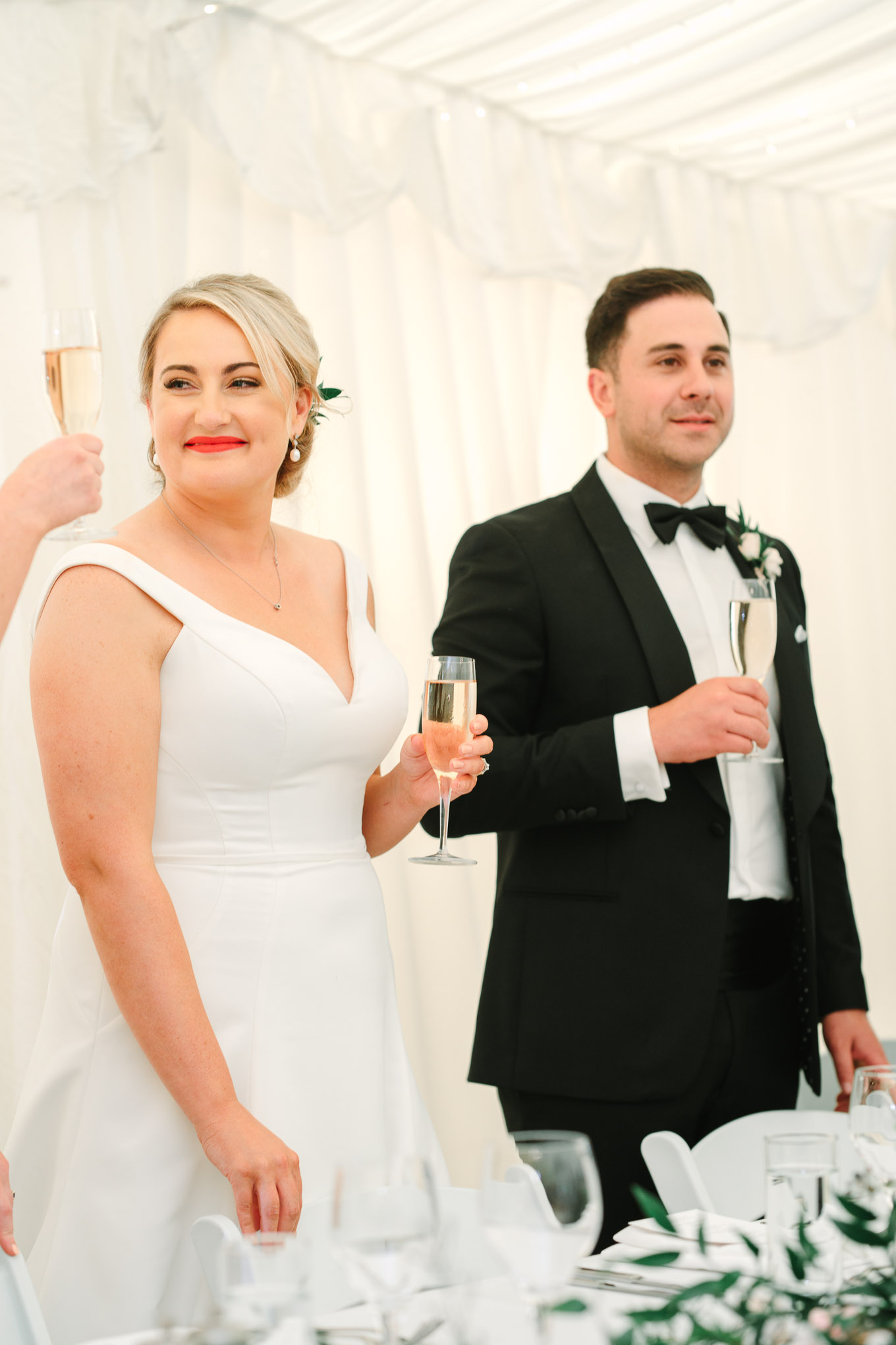 Couple toasting during reception. Millbrook Resort Queenstown New Zealand wedding by Mary Costa Photography | www.marycostaweddings.com