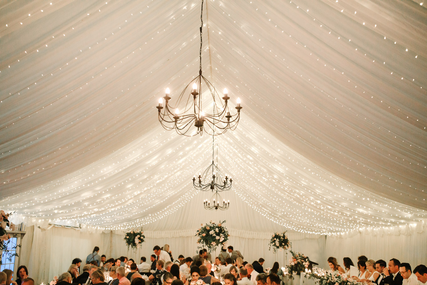 Tented reception with twinkle lights. Millbrook Resort Queenstown New Zealand wedding by Mary Costa Photography | www.marycostaweddings.com