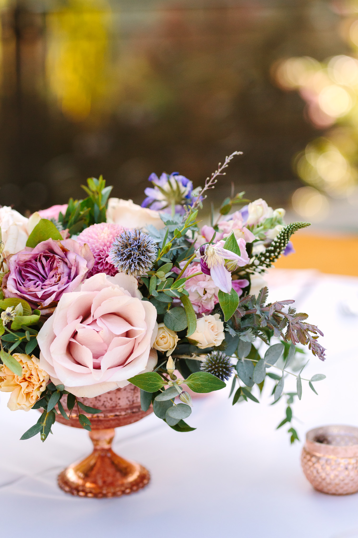 Purple and lavender floral centerpiece at Houdini Estate wedding | Best Southern California Garden Wedding Venues | Colorful and elevated wedding photography for fun-loving couples | #gardenvenue #weddingvenue #socalweddingvenue #bouquetideas #uniquebouquet   Source: Mary Costa Photography | Los Angeles 