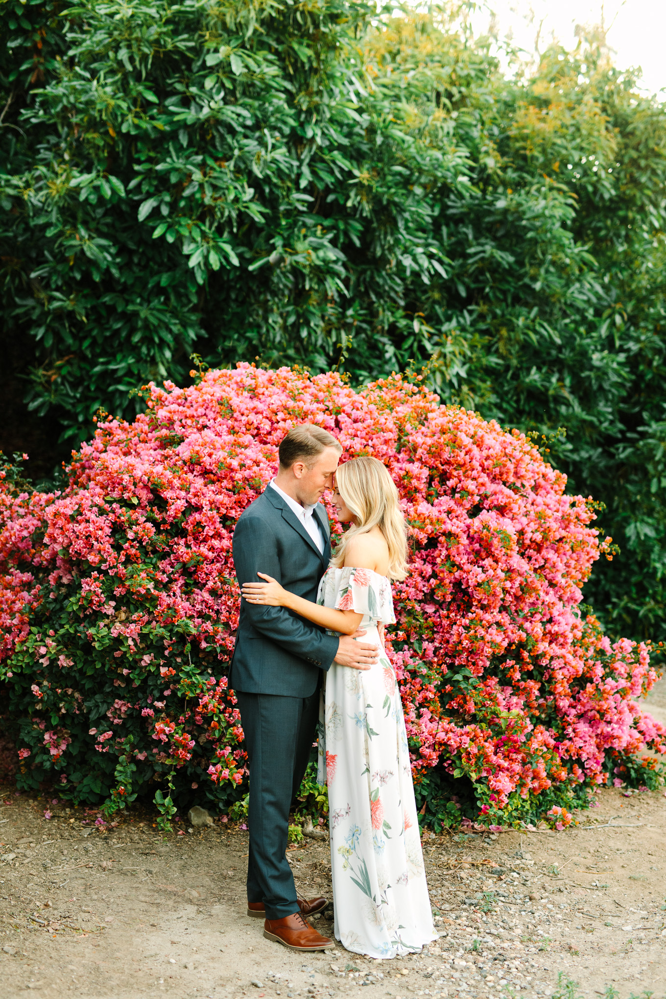 Bride and groom with blooming bougainvillea at Quail Ranch | Best Southern California Garden Wedding Venues | Colorful and elevated wedding photography for fun-loving couples | #gardenvenue #weddingvenue #socalweddingvenue #bouquetideas #uniquebouquet   Source: Mary Costa Photography | Los Angeles 
