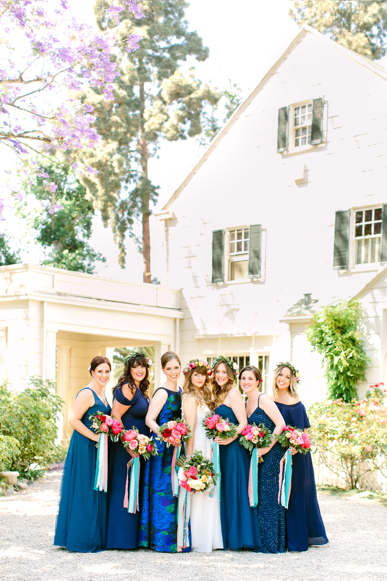 Bridesmaids in mismatched blue with colorful flowers at McCormick Home Ranch wedding | Best Southern California Garden Wedding Venues | Colorful and elevated wedding photography for fun-loving couples | #gardenvenue #weddingvenue #socalweddingvenue #bouquetideas #uniquebouquet   Source: Mary Costa Photography | Los Angeles 
