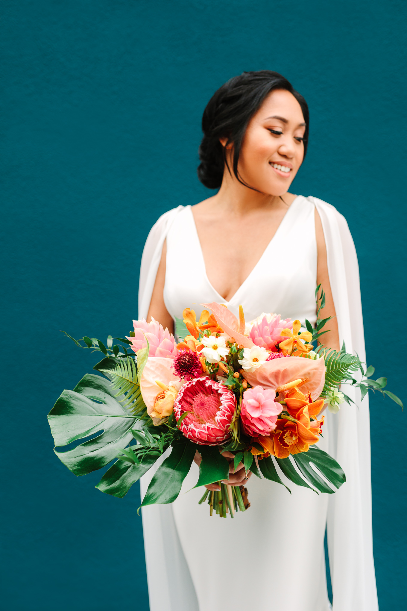 Tropical lush pink bouquet at The Fig House | Beautiful bridal bouquet inspiration and advice | Colorful and elevated wedding photography for fun-loving couples in Southern California | #weddingflowers #weddingbouquet #bridebouquet #bouquetideas #uniquebouquet   Source: Mary Costa Photography | Los Angeles