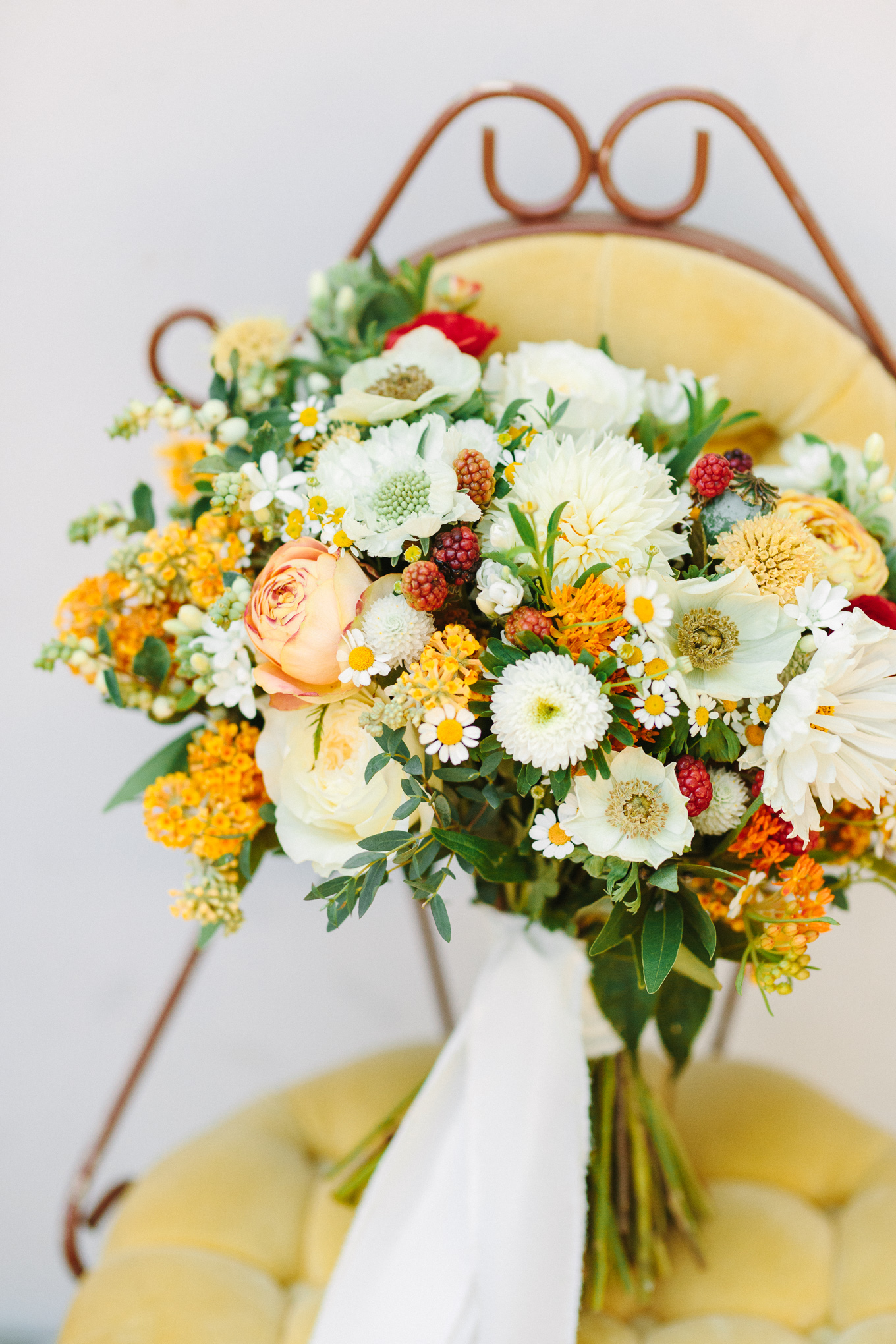 Whimsical autumn yellow, white and red bouquet | Beautiful bridal bouquet inspiration and advice | Colorful and elevated wedding photography for fun-loving couples in Southern California | #weddingflowers #weddingbouquet #bridebouquet #bouquetideas #uniquebouquet   Source: Mary Costa Photography | Los Angeles