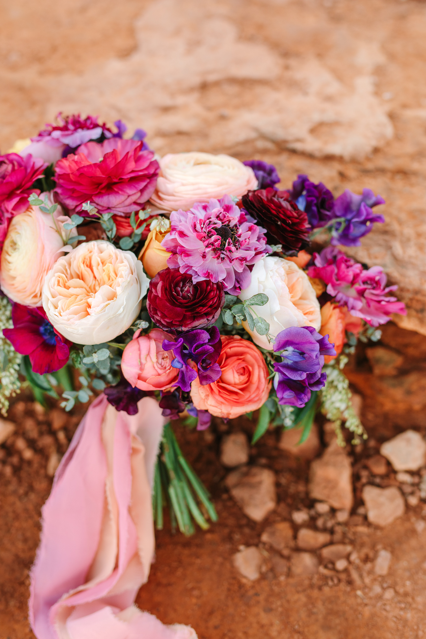 Vibrant sunset-inspired wedding bouquet in Sedona Arizona | Beautiful bridal bouquet inspiration and advice | Colorful and elevated wedding photography for fun-loving couples in Southern California | #weddingflowers #weddingbouquet #bridebouquet #bouquetideas #uniquebouquet   Source: Mary Costa Photography | Los Angeles