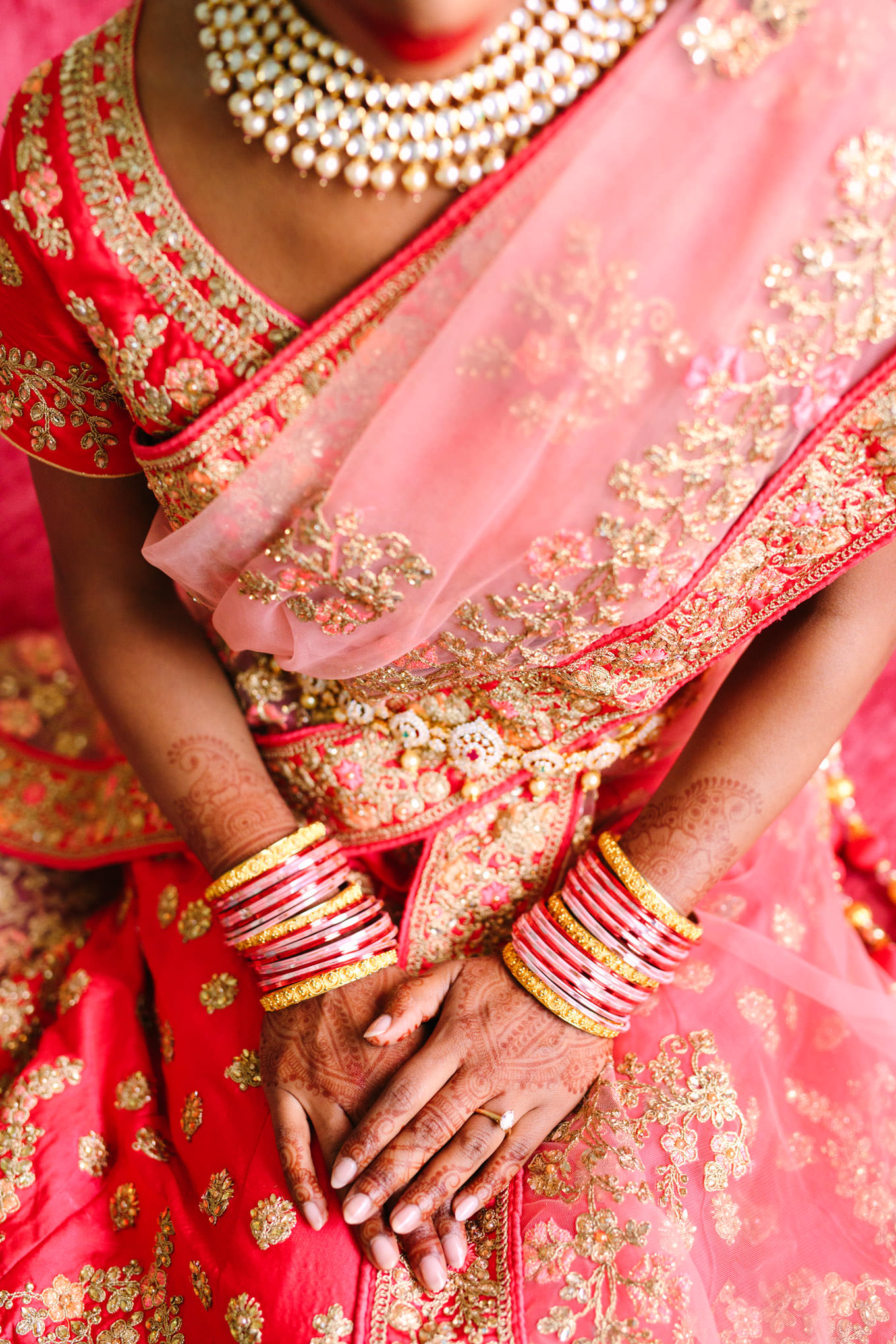 Red bridal saree, jewelry, and mehndi henna. Two Disney artists create a unique and colorful Indian Fusion wedding at The Fig House Los Angeles, featured on Green Wedding Shoes. | Colorful and elevated wedding inspiration for fun-loving couples in Southern California | #indianwedding #indianfusionwedding #thefighouse #losangeleswedding   Source: Mary Costa Photography | Los Angeles
