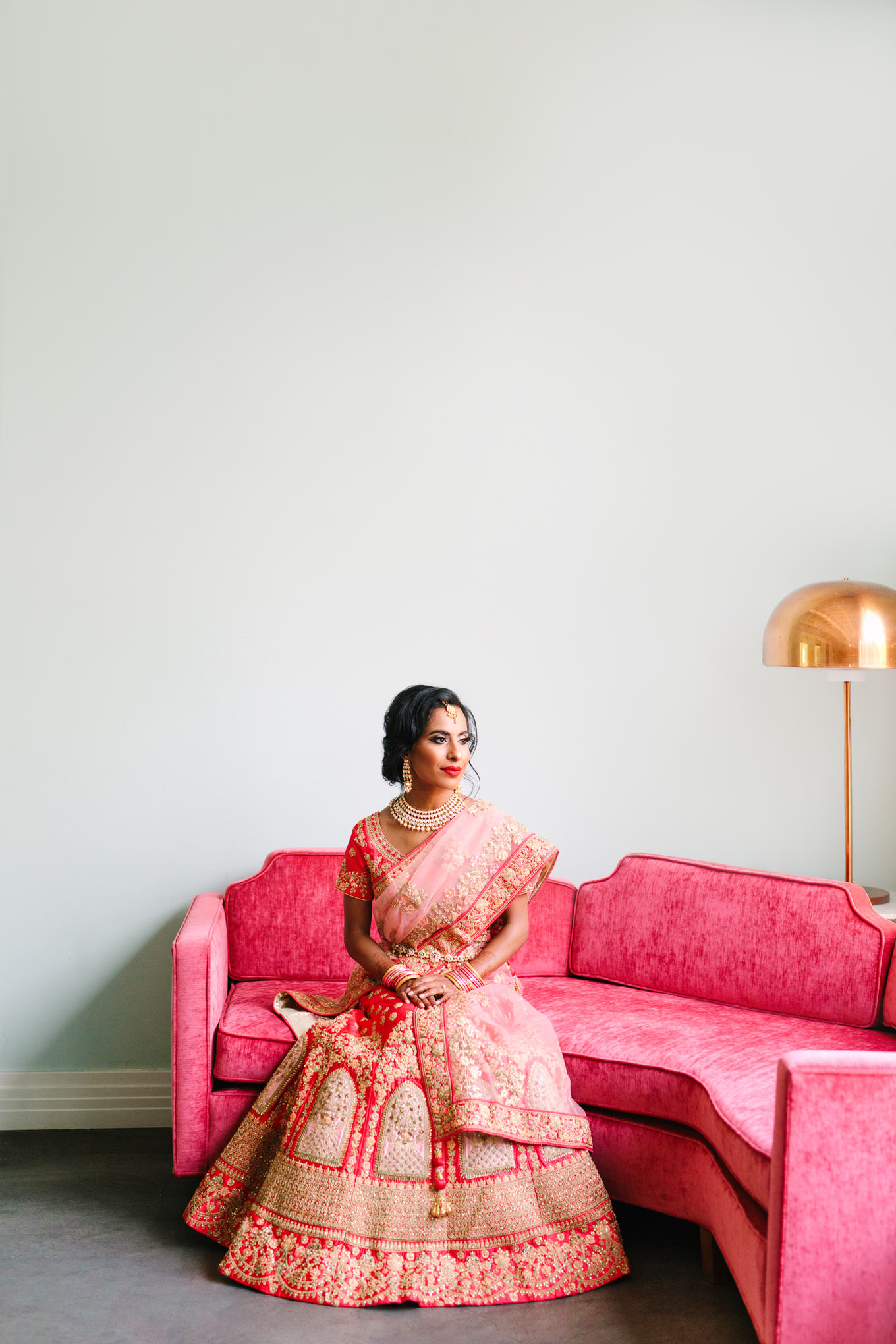 Bride in red saree. Two Disney artists create a unique and colorful Indian Fusion wedding at The Fig House Los Angeles, featured on Green Wedding Shoes. | Colorful and elevated wedding inspiration for fun-loving couples in Southern California | #indianwedding #indianfusionwedding #thefighouse #losangeleswedding   Source: Mary Costa Photography | Los Angeles