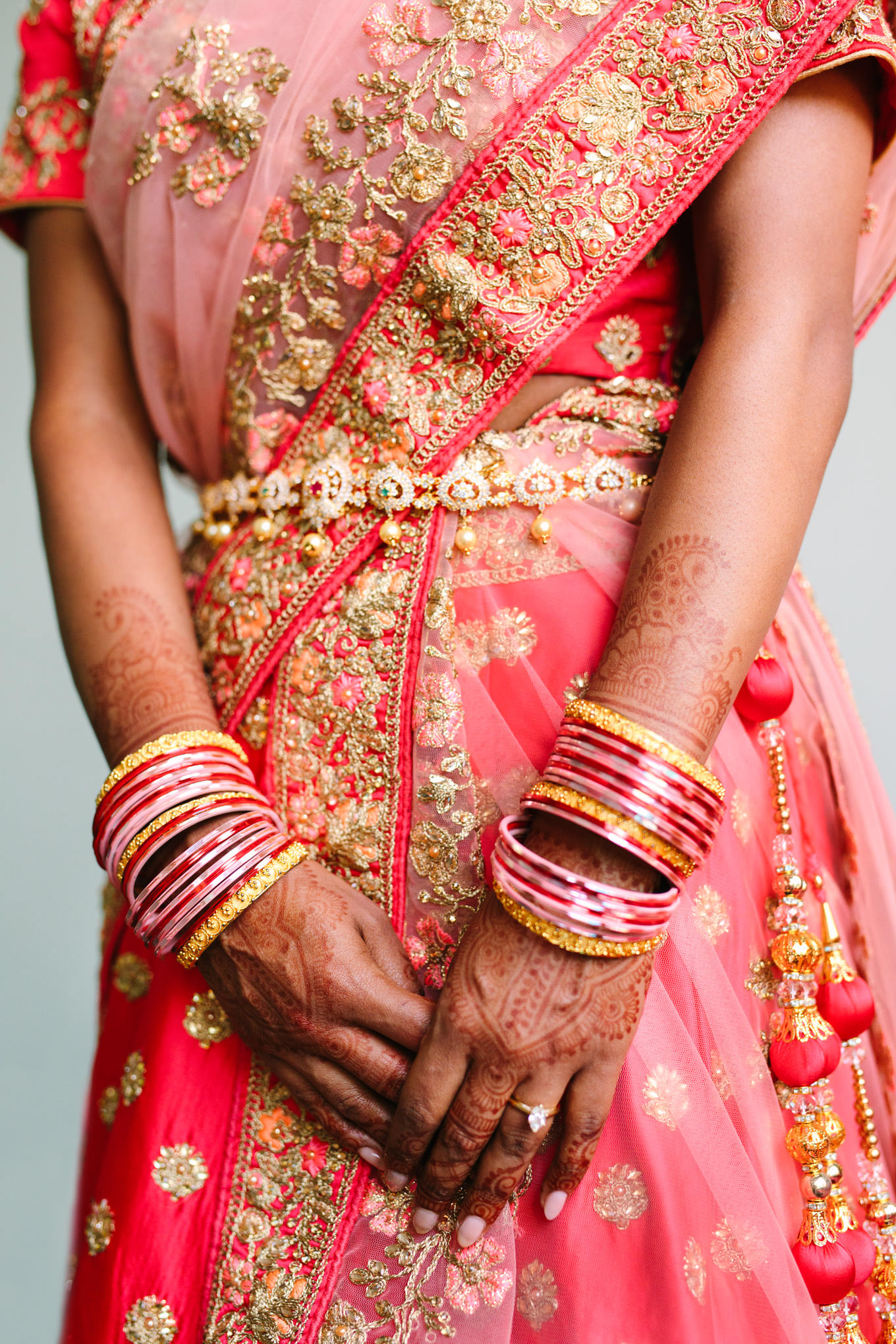 Red bridal saree, jewelry, and mehndi henna. Two Disney artists create a unique and colorful Indian Fusion wedding at The Fig House Los Angeles, featured on Green Wedding Shoes. | Colorful and elevated wedding inspiration for fun-loving couples in Southern California | #indianwedding #indianfusionwedding #thefighouse #losangeleswedding   Source: Mary Costa Photography | Los Angeles