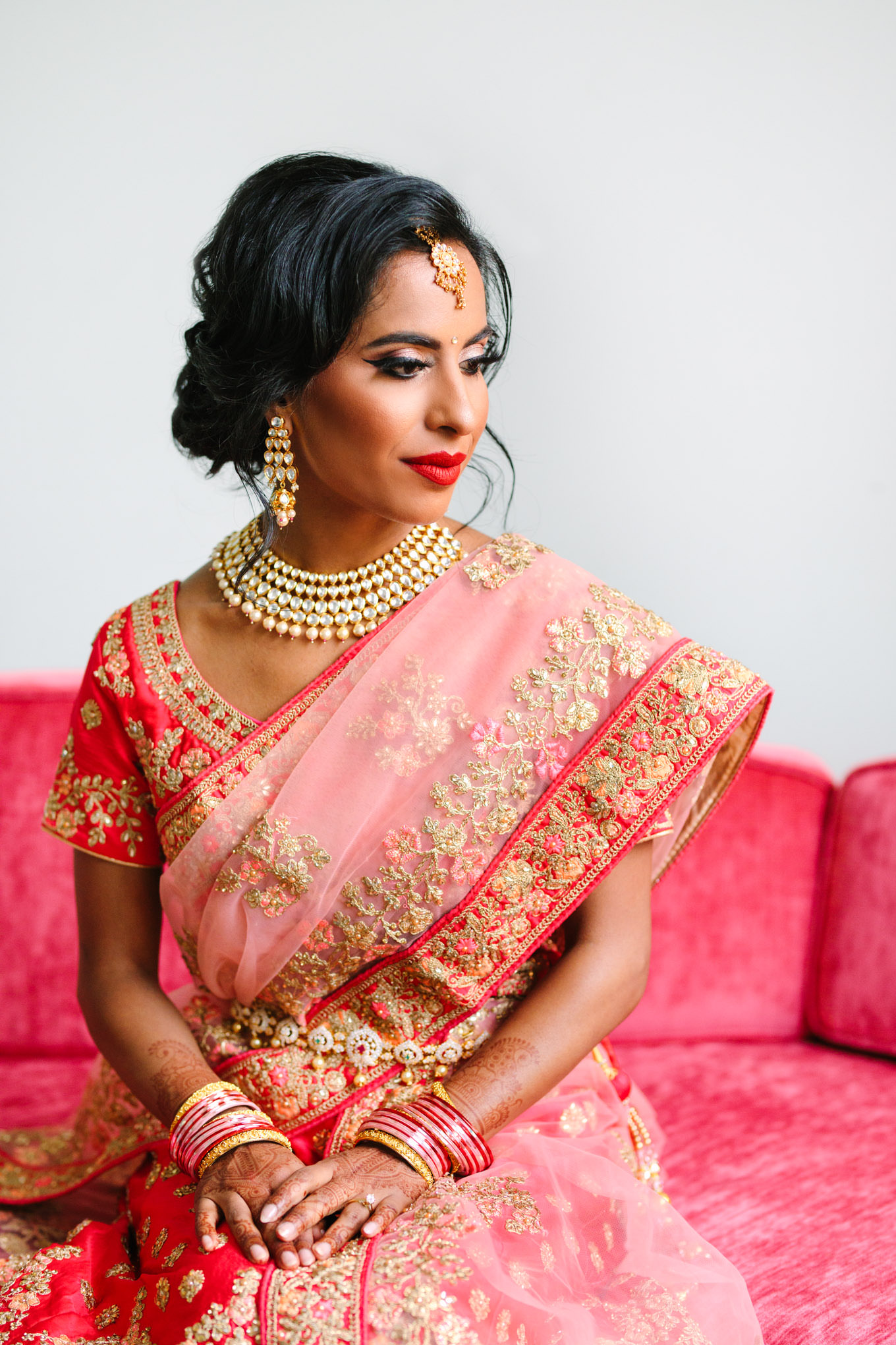 Portrait of bride in red saree. Two Disney artists create a unique and colorful Indian Fusion wedding at The Fig House Los Angeles, featured on Green Wedding Shoes. | Colorful and elevated wedding inspiration for fun-loving couples in Southern California | #indianwedding #indianfusionwedding #thefighouse #losangeleswedding   Source: Mary Costa Photography | Los Angeles