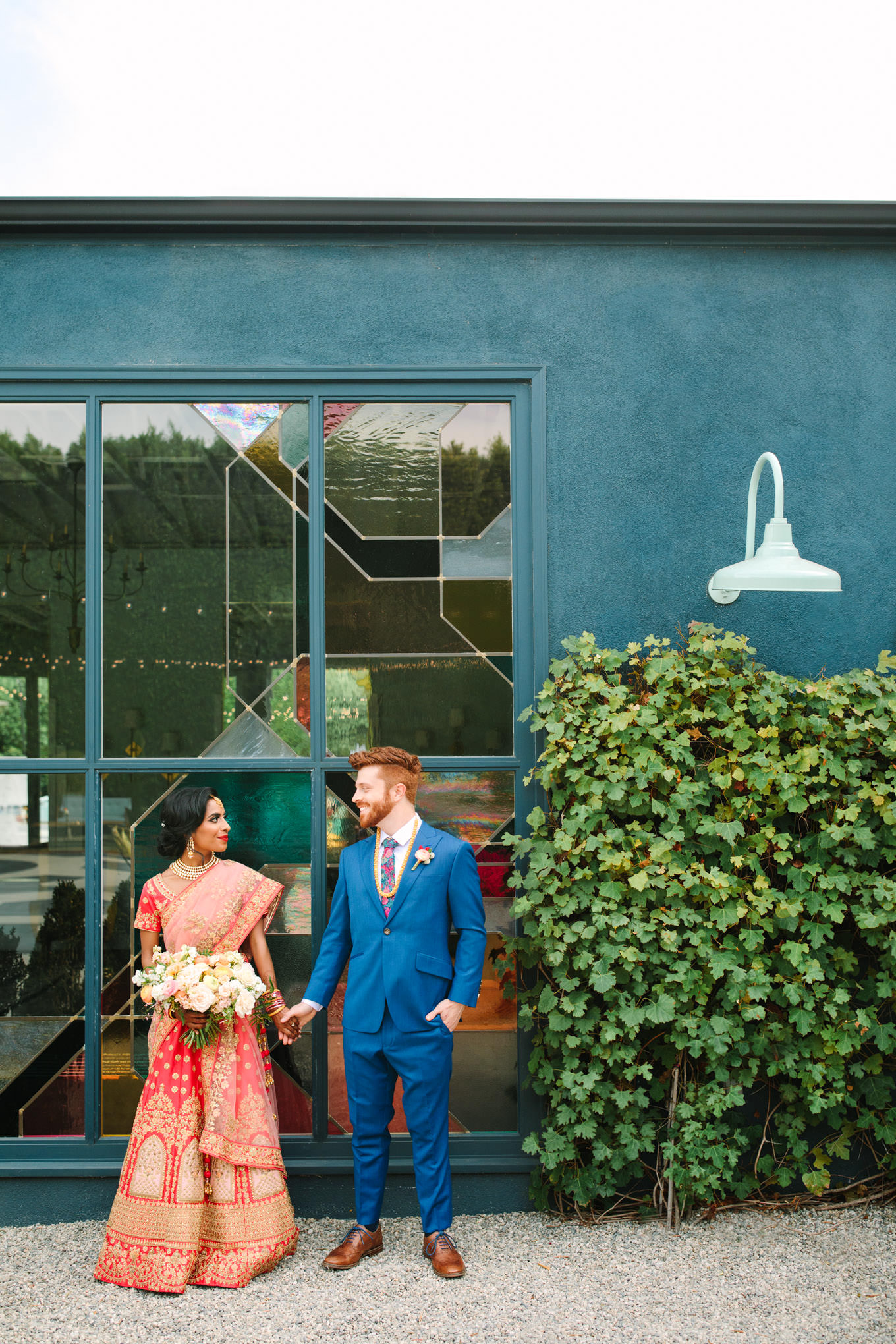 Bride and groom portrait outside venue. Two Disney artists create a unique and colorful Indian Fusion wedding at The Fig House Los Angeles, featured on Green Wedding Shoes. | Colorful and elevated wedding inspiration for fun-loving couples in Southern California | #indianwedding #indianfusionwedding #thefighouse #losangeleswedding   Source: Mary Costa Photography | Los Angeles