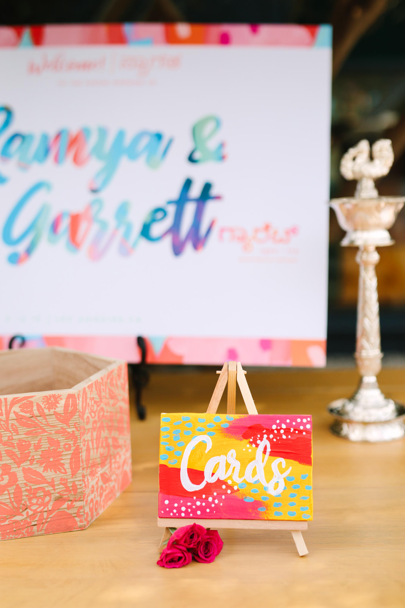 Custom painted card sign. Two Disney artists create a unique and colorful Indian Fusion wedding at The Fig House Los Angeles, featured on Green Wedding Shoes. | Colorful and elevated wedding inspiration for fun-loving couples in Southern California | #indianwedding #indianfusionwedding #thefighouse #losangeleswedding   Source: Mary Costa Photography | Los Angeles
