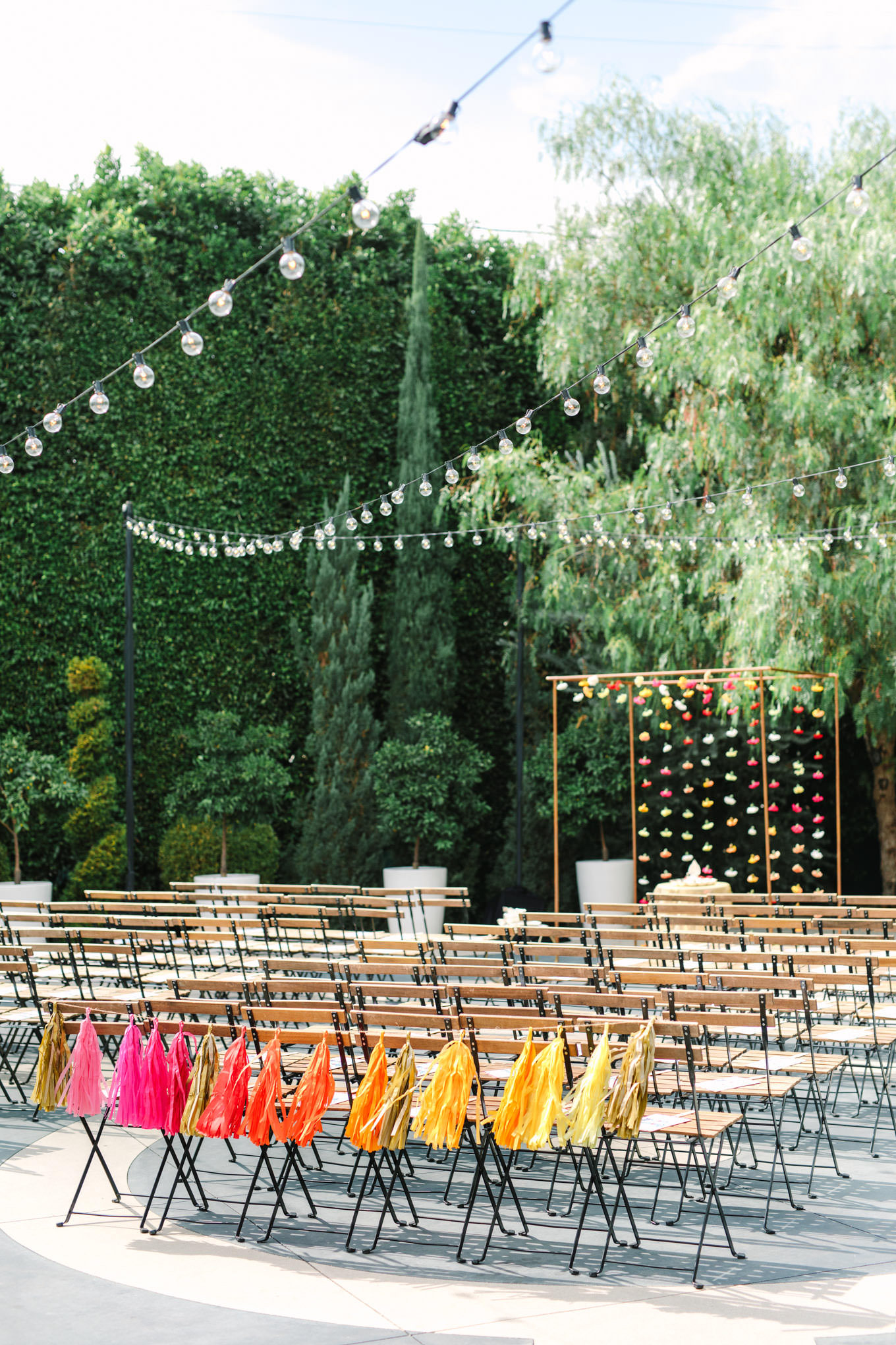 Colorful tassels at wedding ceremony. Two Disney artists create a unique and colorful Indian Fusion wedding at The Fig House Los Angeles, featured on Green Wedding Shoes. | Colorful and elevated wedding inspiration for fun-loving couples in Southern California | #indianwedding #indianfusionwedding #thefighouse #losangeleswedding   Source: Mary Costa Photography | Los Angeles