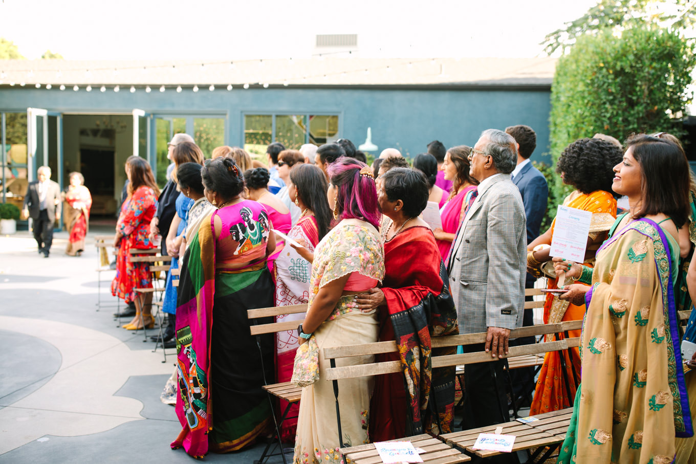 Guests at wedding ceremony. Two Disney artists create a unique and colorful Indian Fusion wedding at The Fig House Los Angeles, featured on Green Wedding Shoes. | Colorful and elevated wedding inspiration for fun-loving couples in Southern California | #indianwedding #indianfusionwedding #thefighouse #losangeleswedding   Source: Mary Costa Photography | Los Angeles