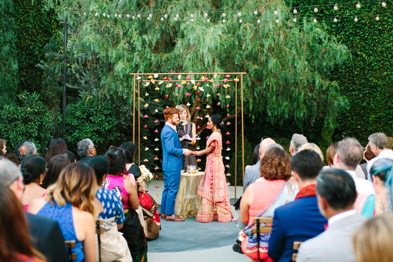 Wedding ceremony wide shot. Two Disney artists create a unique and colorful Indian Fusion wedding at The Fig House Los Angeles, featured on Green Wedding Shoes. | Colorful and elevated wedding inspiration for fun-loving couples in Southern California | #indianwedding #indianfusionwedding #thefighouse #losangeleswedding   Source: Mary Costa Photography | Los Angeles