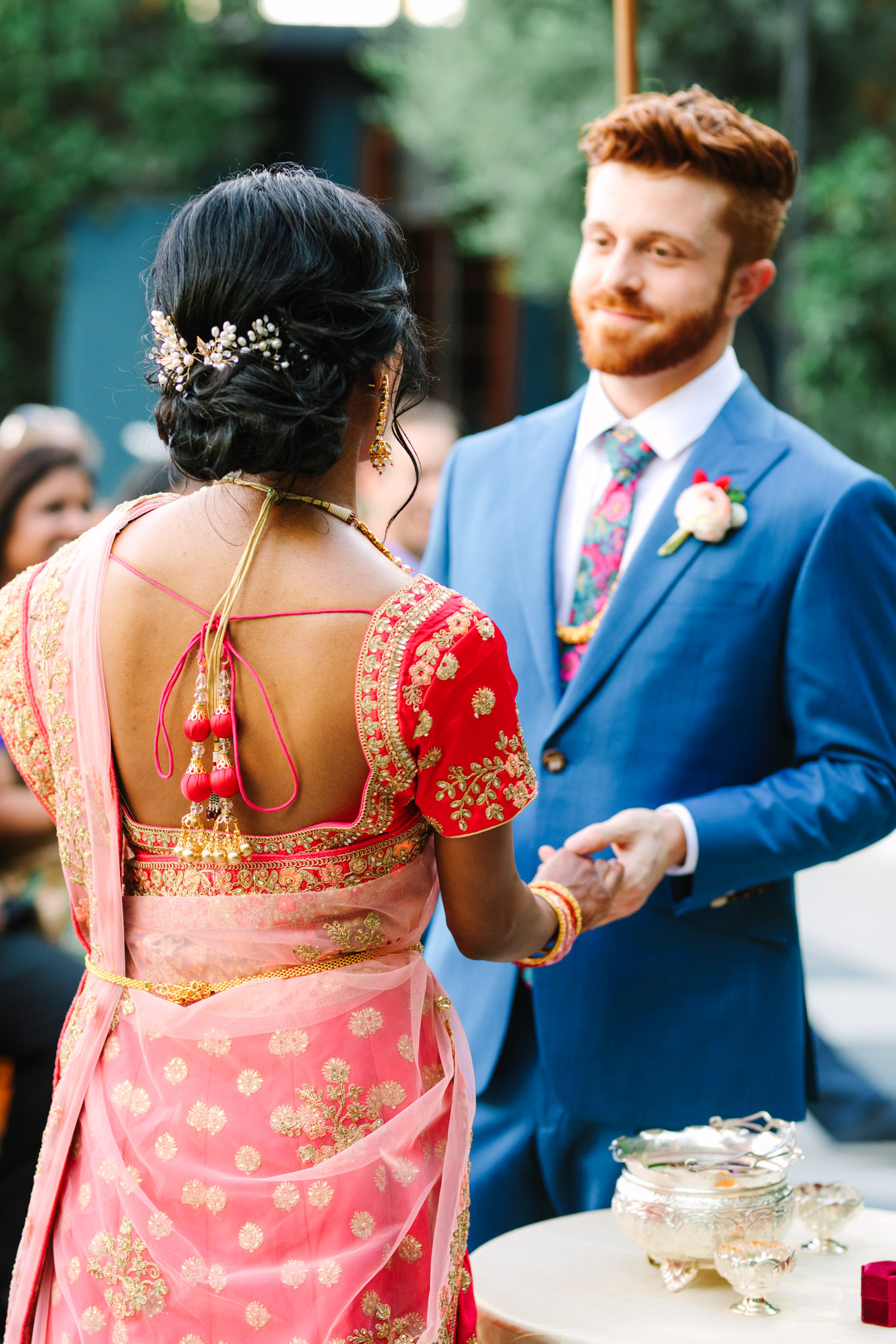 Bridal red saree detail during ceremony. Two Disney artists create a unique and colorful Indian Fusion wedding at The Fig House Los Angeles, featured on Green Wedding Shoes. | Colorful and elevated wedding inspiration for fun-loving couples in Southern California | #indianwedding #indianfusionwedding #thefighouse #losangeleswedding   Source: Mary Costa Photography | Los Angeles