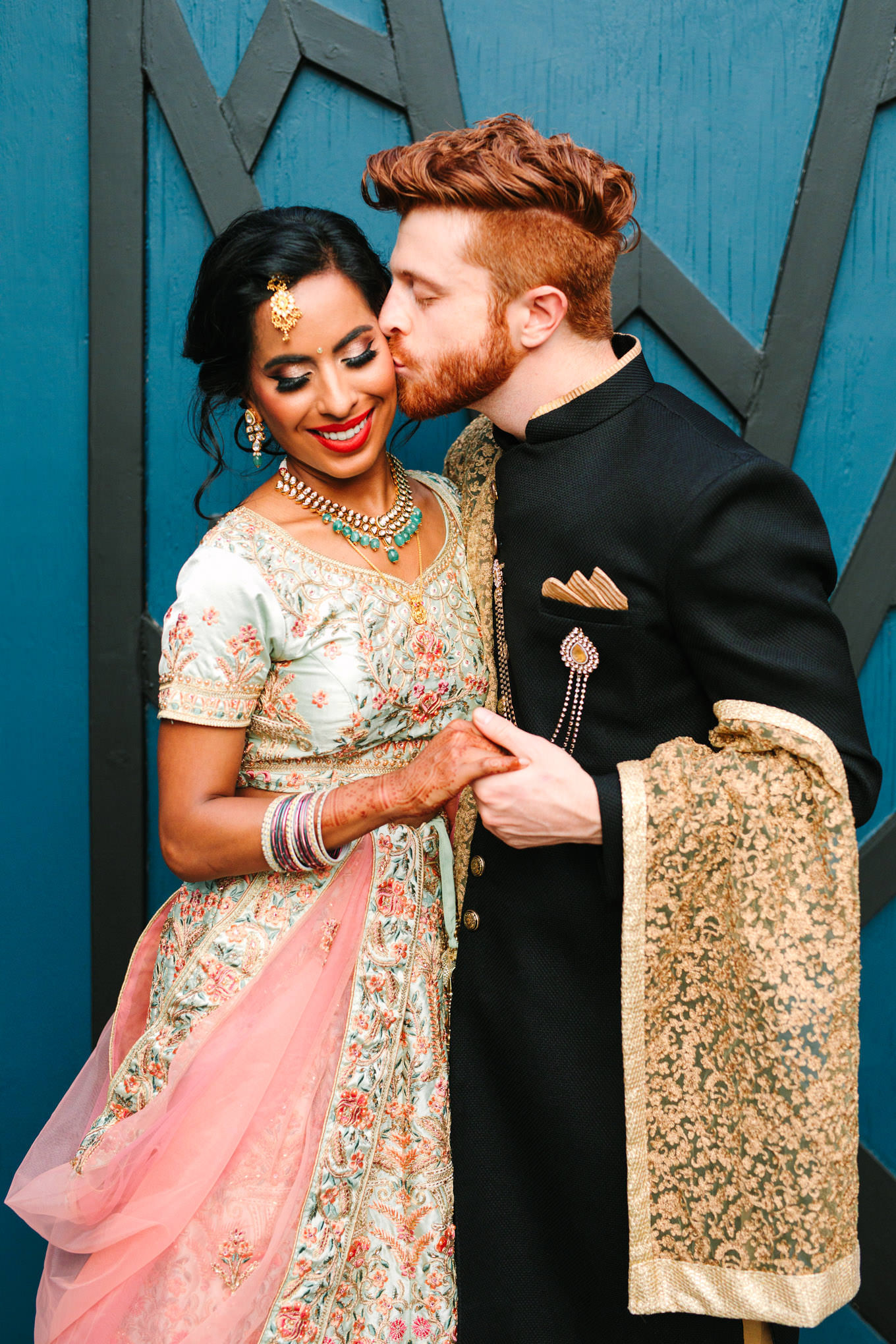Bride and groom in traditional Indian wedding outfits. Two Disney artists create a unique and colorful Indian Fusion wedding at The Fig House Los Angeles, featured on Green Wedding Shoes. | Colorful and elevated wedding inspiration for fun-loving couples in Southern California | #indianwedding #indianfusionwedding #thefighouse #losangeleswedding   Source: Mary Costa Photography | Los Angeles