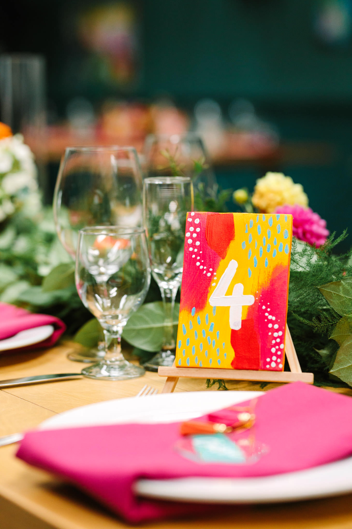 Hand-painted wedding table number. Two Disney artists create a unique and colorful Indian Fusion wedding at The Fig House Los Angeles, featured on Green Wedding Shoes. | Colorful and elevated wedding inspiration for fun-loving couples in Southern California | #indianwedding #indianfusionwedding #thefighouse #losangeleswedding   Source: Mary Costa Photography | Los Angeles