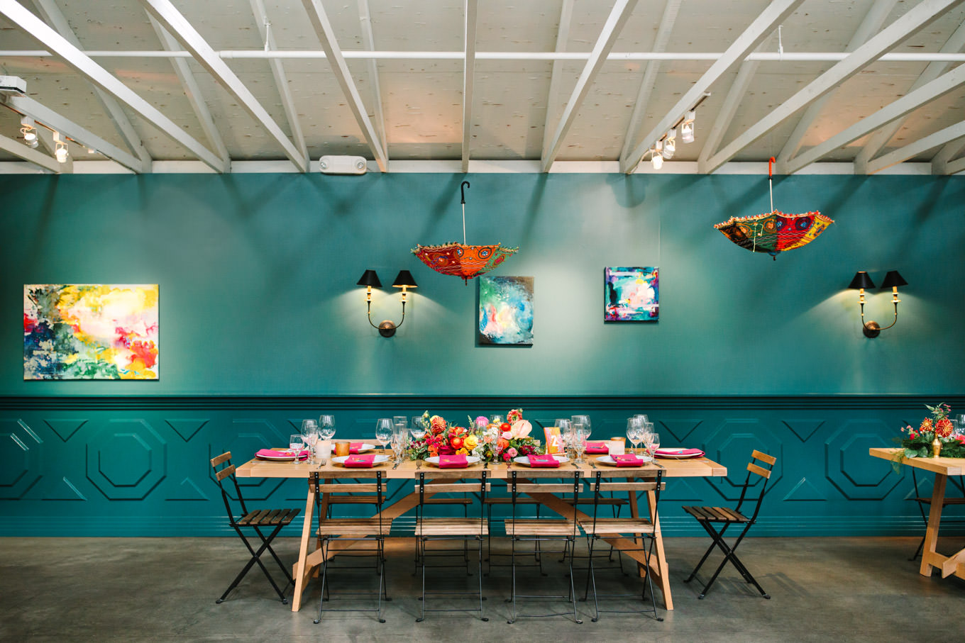 Wedding reception table with upside down umbrellas. Two Disney artists create a unique and colorful Indian Fusion wedding at The Fig House Los Angeles, featured on Green Wedding Shoes. | Colorful and elevated wedding inspiration for fun-loving couples in Southern California | #indianwedding #indianfusionwedding #thefighouse #losangeleswedding   Source: Mary Costa Photography | Los Angeles