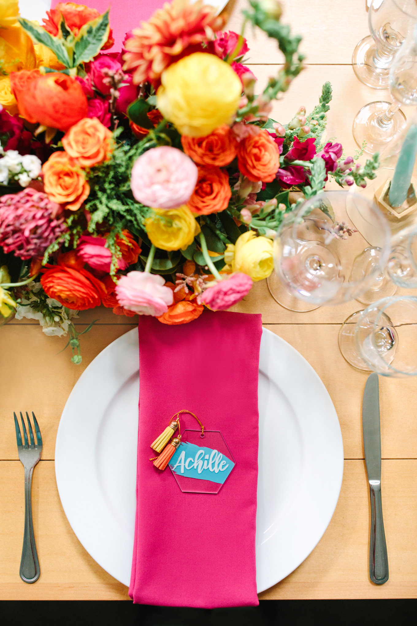 Overhead shot of colorful pink wedding table. Two Disney artists create a unique and colorful Indian Fusion wedding at The Fig House Los Angeles, featured on Green Wedding Shoes. | Colorful and elevated wedding inspiration for fun-loving couples in Southern California | #indianwedding #indianfusionwedding #thefighouse #losangeleswedding   Source: Mary Costa Photography | Los Angeles