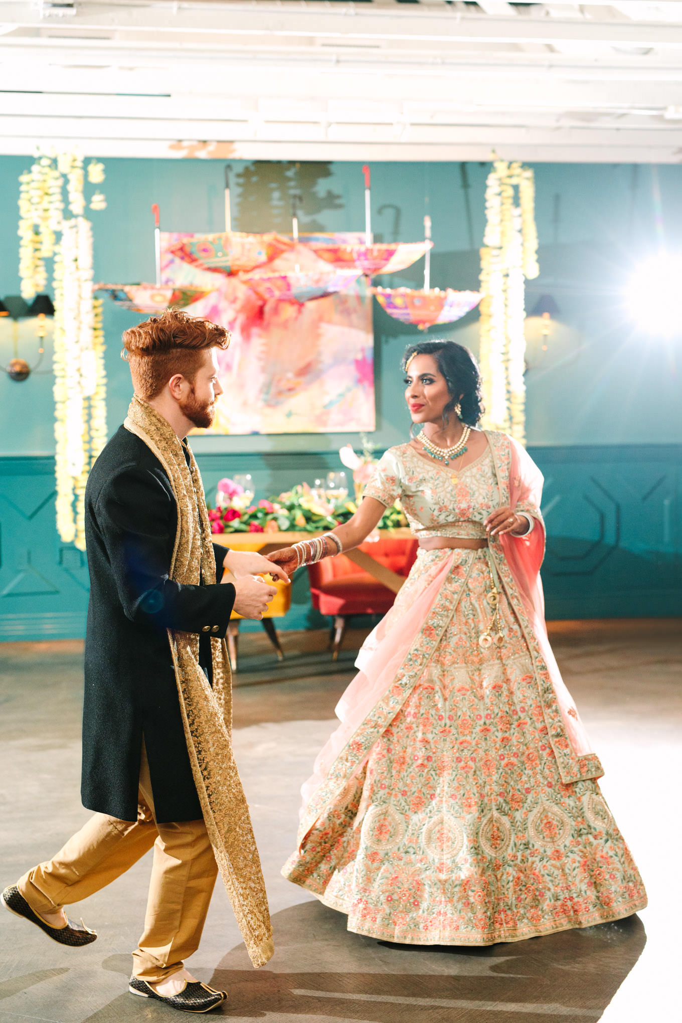 Groom and bride's first dance. Two Disney artists create a unique and colorful Indian Fusion wedding at The Fig House Los Angeles, featured on Green Wedding Shoes. | Colorful and elevated wedding inspiration for fun-loving couples in Southern California | #indianwedding #indianfusionwedding #thefighouse #losangeleswedding   Source: Mary Costa Photography | Los Angeles