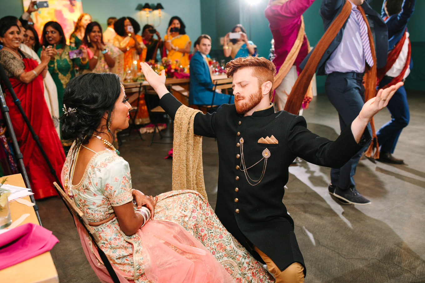Surprise Bollywood dance at wedding reception. Two Disney artists create a unique and colorful Indian Fusion wedding at The Fig House Los Angeles, featured on Green Wedding Shoes. | Colorful and elevated wedding inspiration for fun-loving couples in Southern California | #indianwedding #indianfusionwedding #thefighouse #losangeleswedding   Source: Mary Costa Photography | Los Angeles