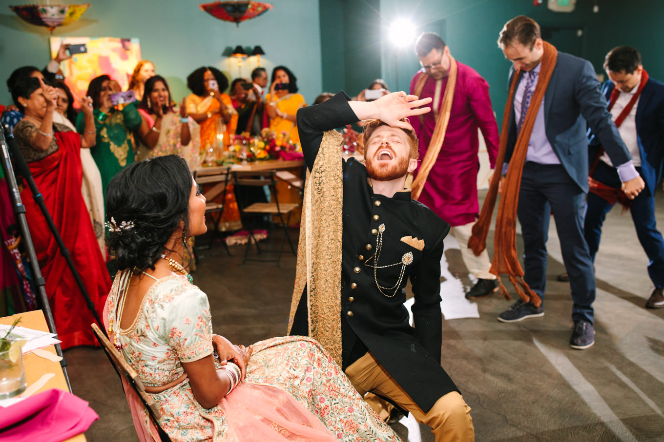 Surprise Bollywood dance at wedding reception. Two Disney artists create a unique and colorful Indian Fusion wedding at The Fig House Los Angeles, featured on Green Wedding Shoes. | Colorful and elevated wedding inspiration for fun-loving couples in Southern California | #indianwedding #indianfusionwedding #thefighouse #losangeleswedding   Source: Mary Costa Photography | Los Angeles