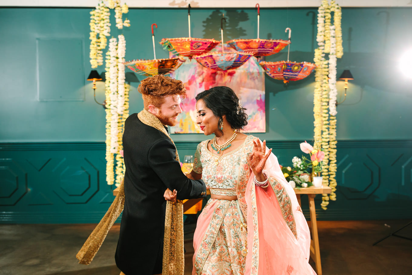Bride and groom dancing during wedding reception. Two Disney artists create a unique and colorful Indian Fusion wedding at The Fig House Los Angeles, featured on Green Wedding Shoes. | Colorful and elevated wedding inspiration for fun-loving couples in Southern California | #indianwedding #indianfusionwedding #thefighouse #losangeleswedding   Source: Mary Costa Photography | Los Angeles