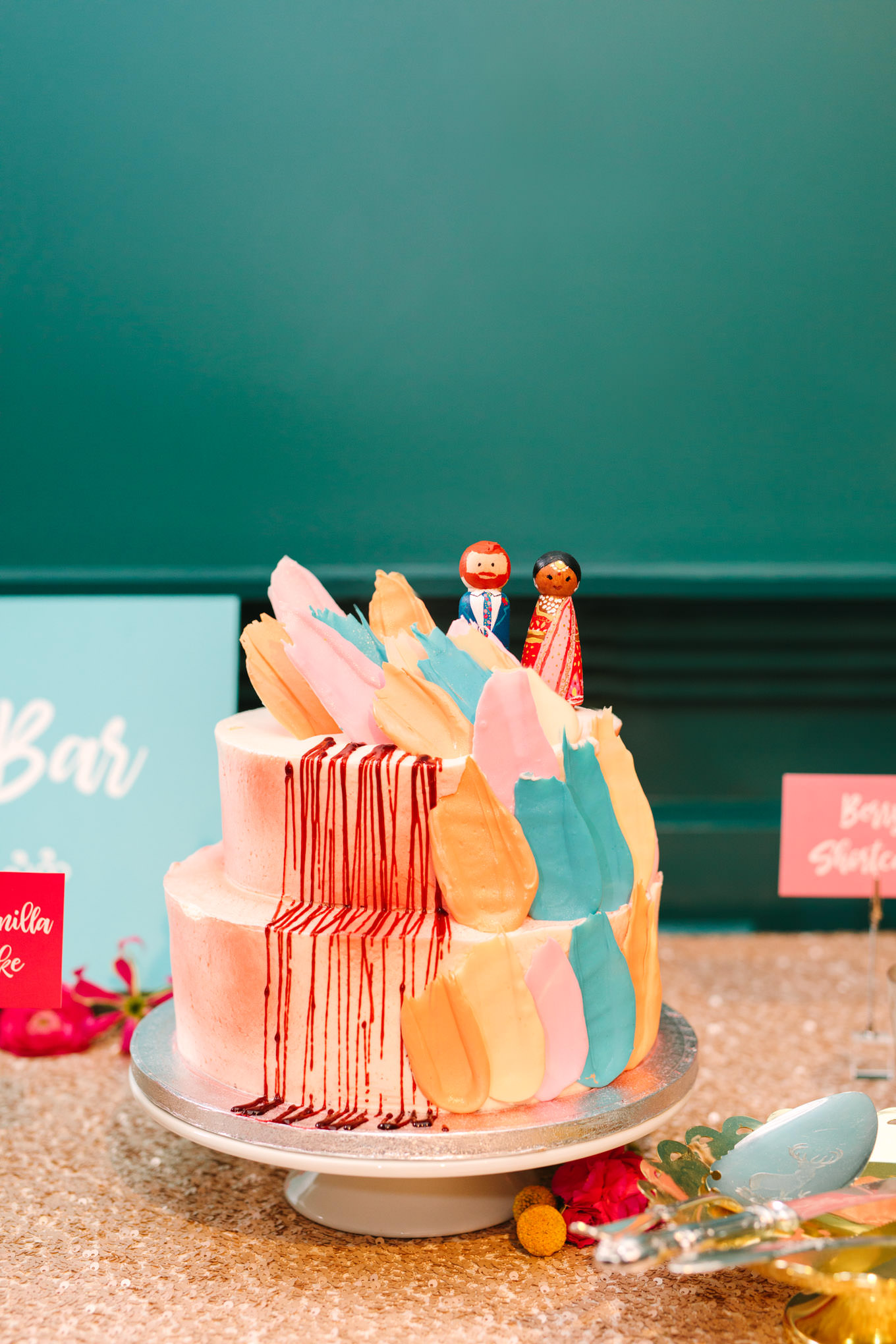 Colorful cake by Lark Cake Shop. Two Disney artists create a unique and colorful Indian Fusion wedding at The Fig House Los Angeles, featured on Green Wedding Shoes. | Colorful and elevated wedding inspiration for fun-loving couples in Southern California | #indianwedding #indianfusionwedding #thefighouse #losangeleswedding   Source: Mary Costa Photography | Los Angeles